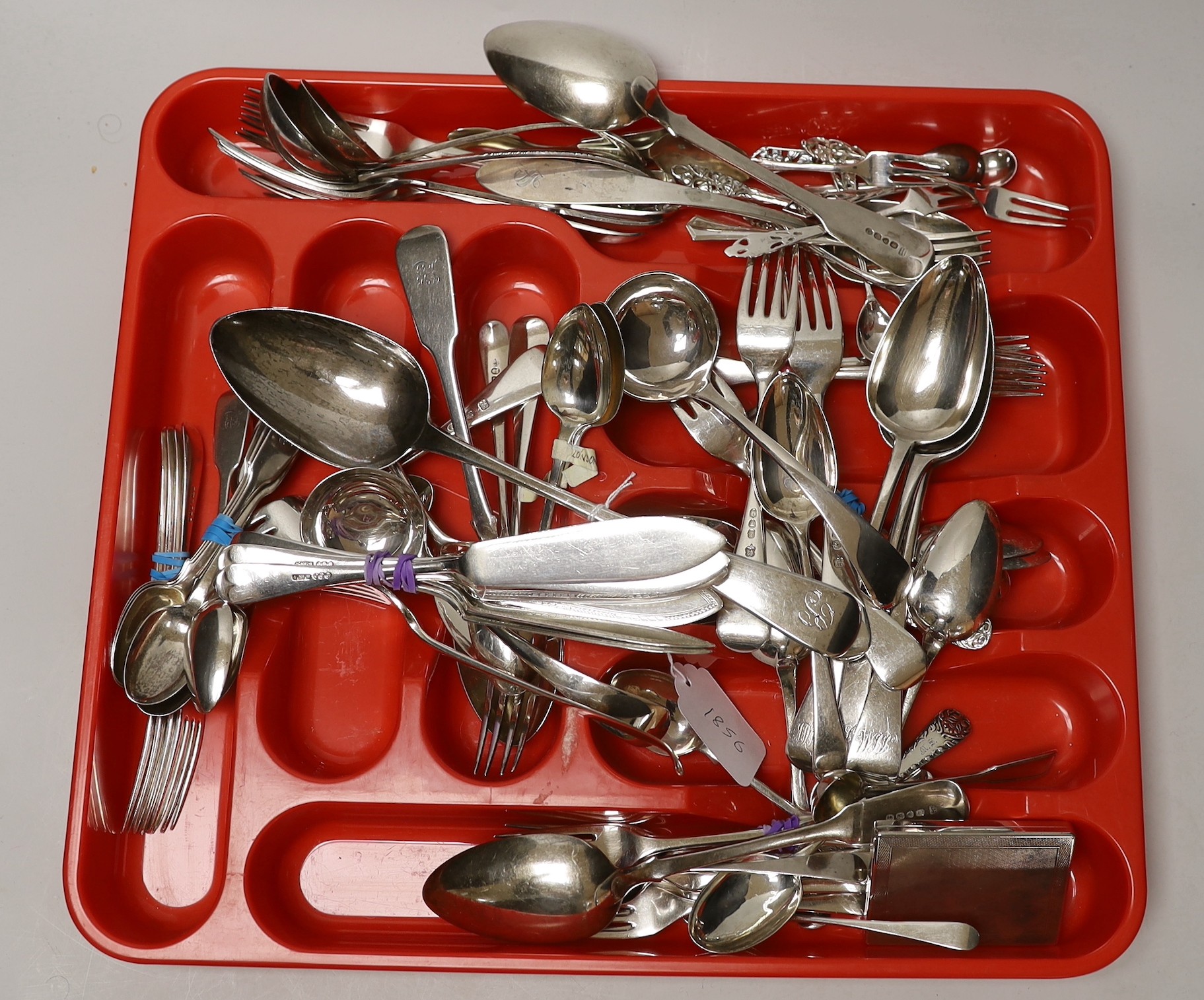 A large quantity of mixed silver cutlery, various dates, makers and patterns, including a George III silver basting spoon, a silver cigarette case and a small group of plated flatware.                                    