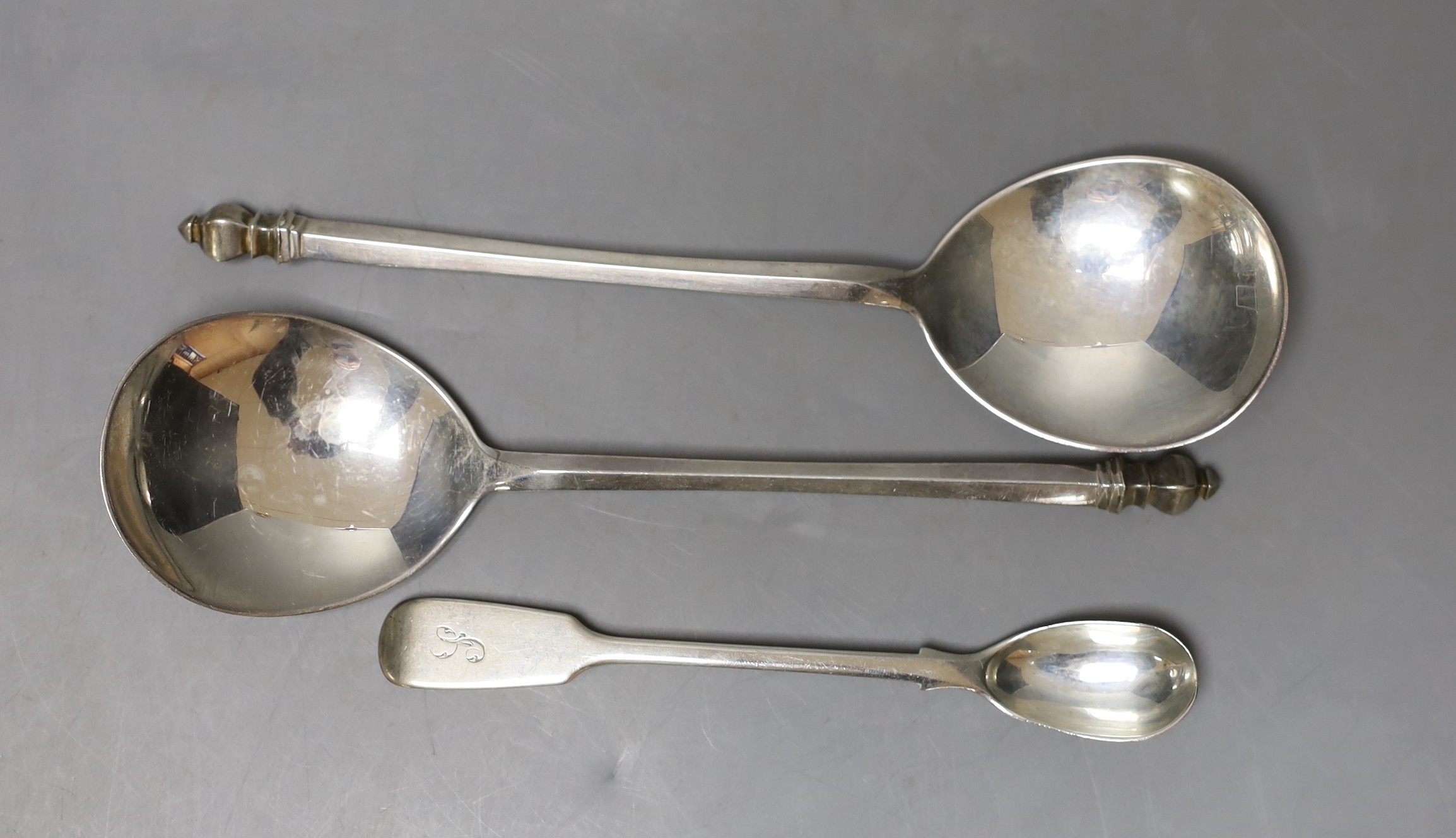 A pair of George V silver serving? spoons, Mappin & Webb, Birmingham, 1930, 19.1cm and an earlier silver condiment spoon, 152 grams.                                                                                        