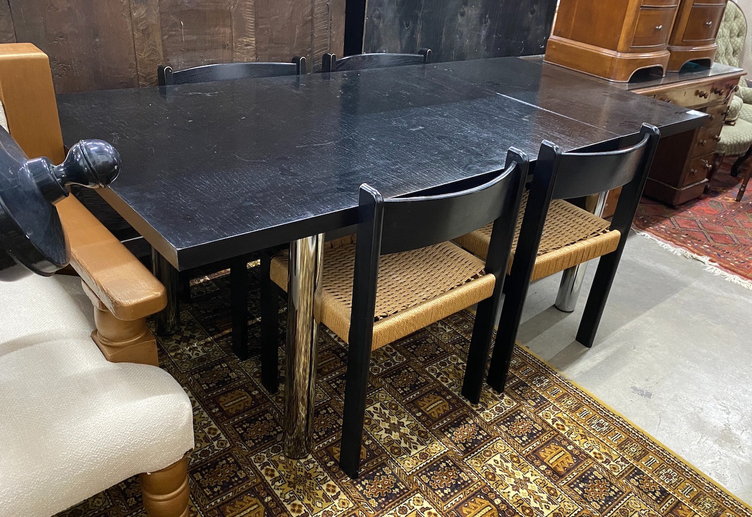 A 1970’s Habitat black ash rectangular dining table, length 194cm, width 90cm, height 74cm and four chairs, width 47cm, depth 46cm, height 79cm                                                                             
