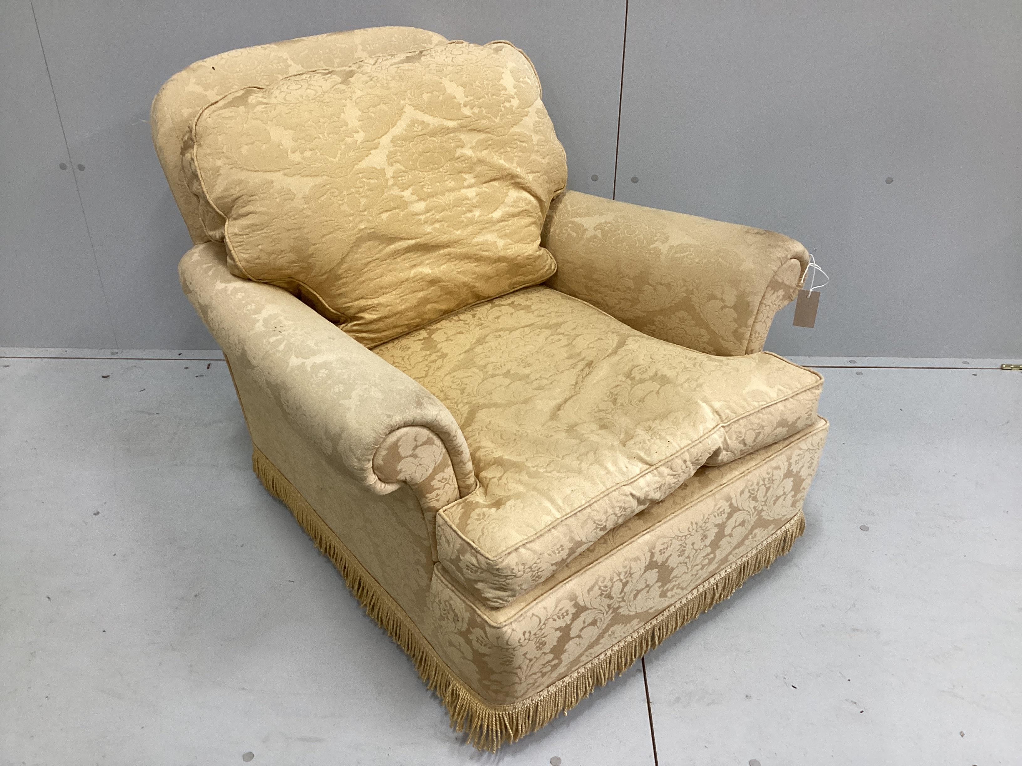 A mid 20th century Howard style upholstered armchair, width 92cm, depth 90cm, height 76cm                                                                                                                                   