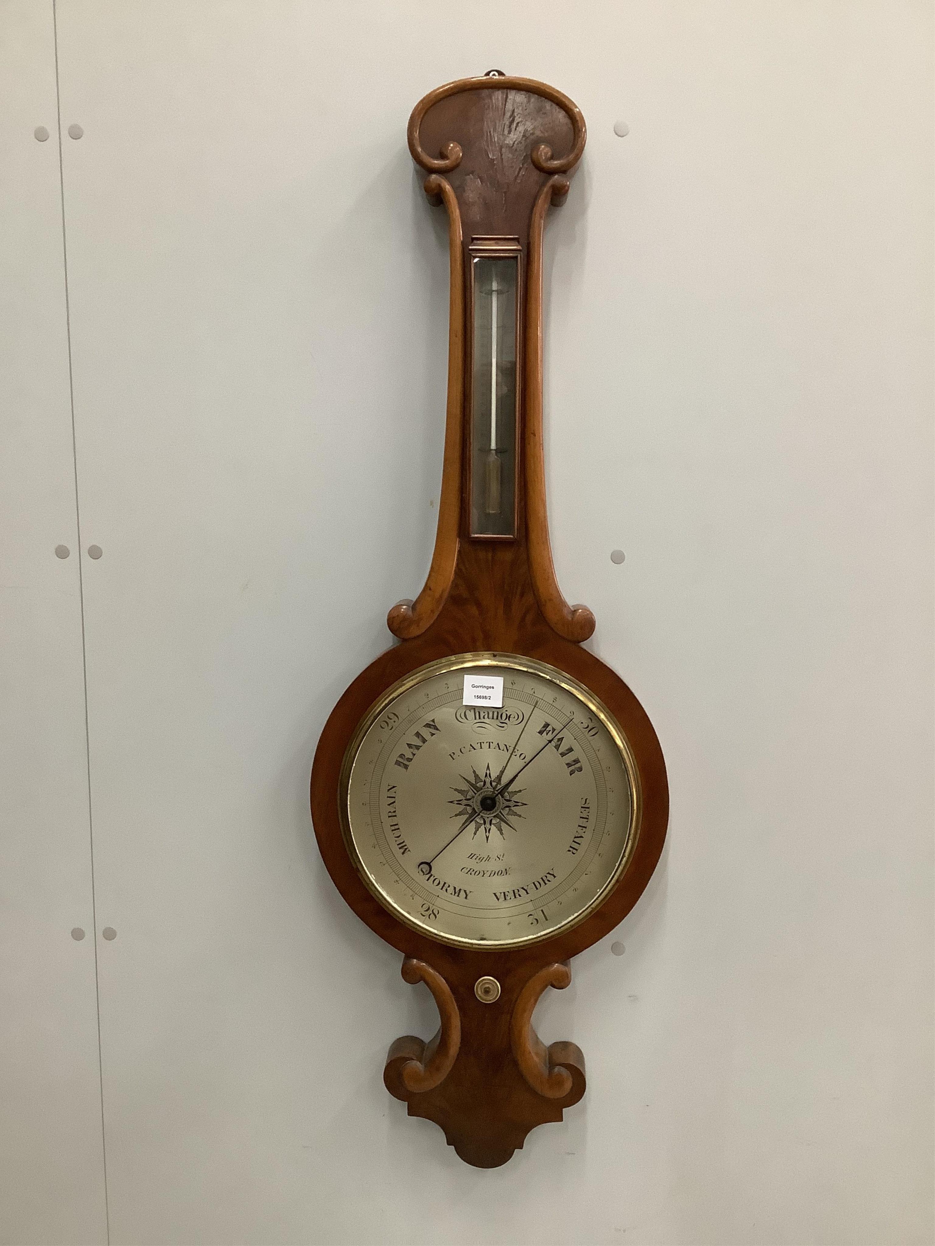 P. Cattaneo, High Street, Croydon. An early Victorian flamed mahogany wheel barometer, height 114cm. Condition - fair to good                                                                                               