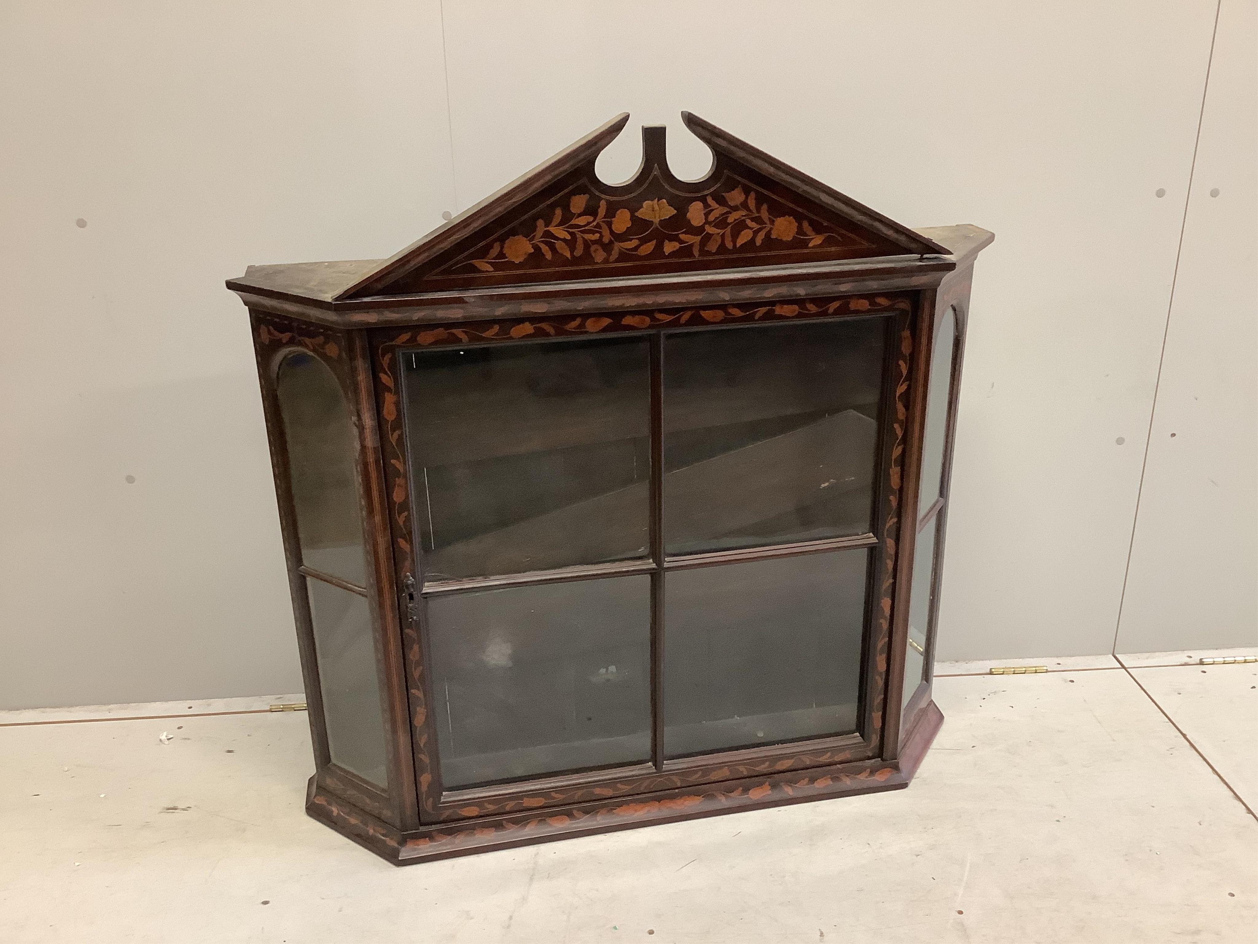 An early 19th Dutch floral marquetry inlaid walnut wall cabinet, (locked,no key), width 110cm, depth 24cm, height 97cm. Condition - fair                                                                                    