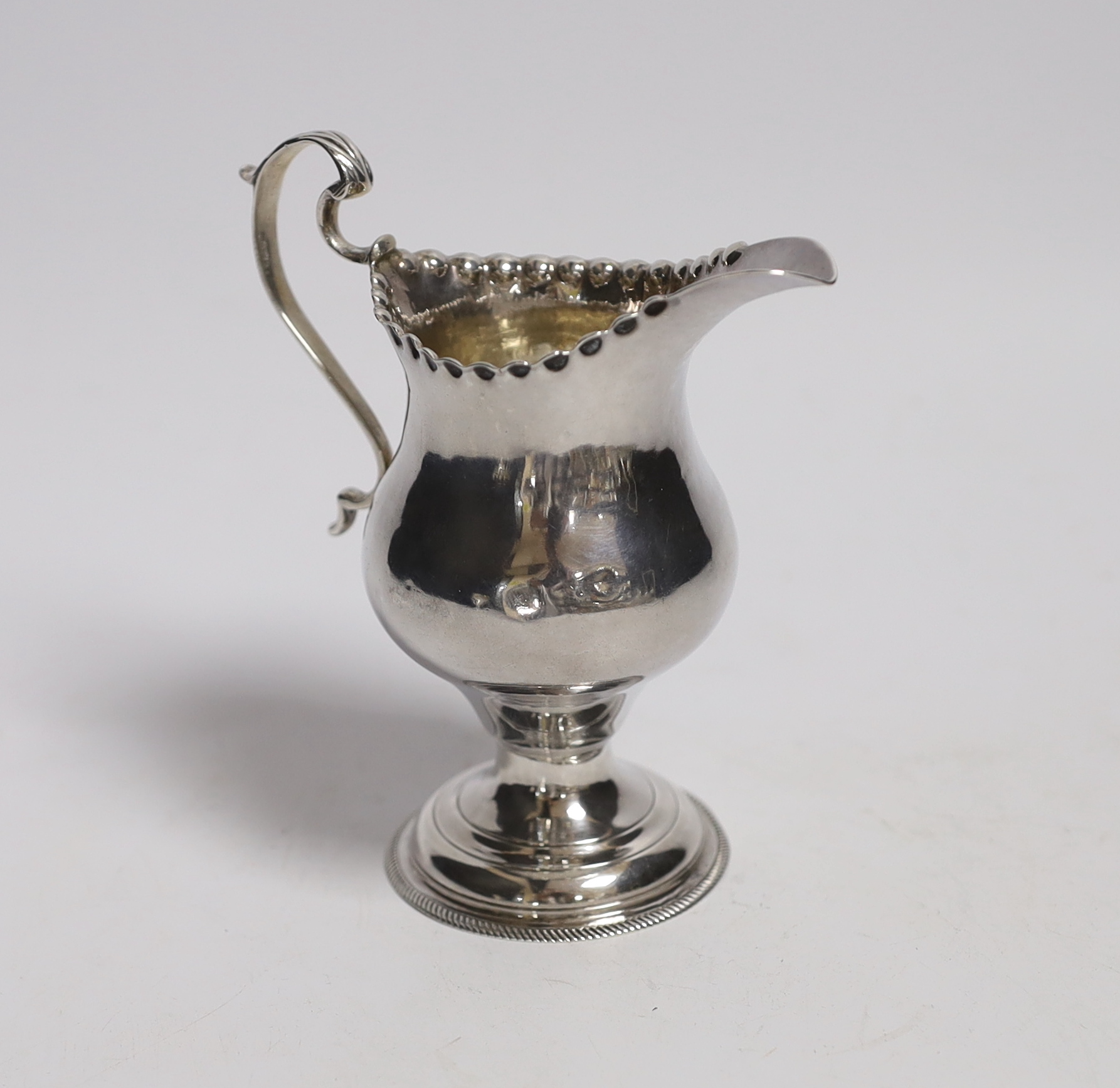 A George III silver inverted pear shaped cream jug, by Hester Bateman, London, 1775, 11.3cm.                                                                                                                                