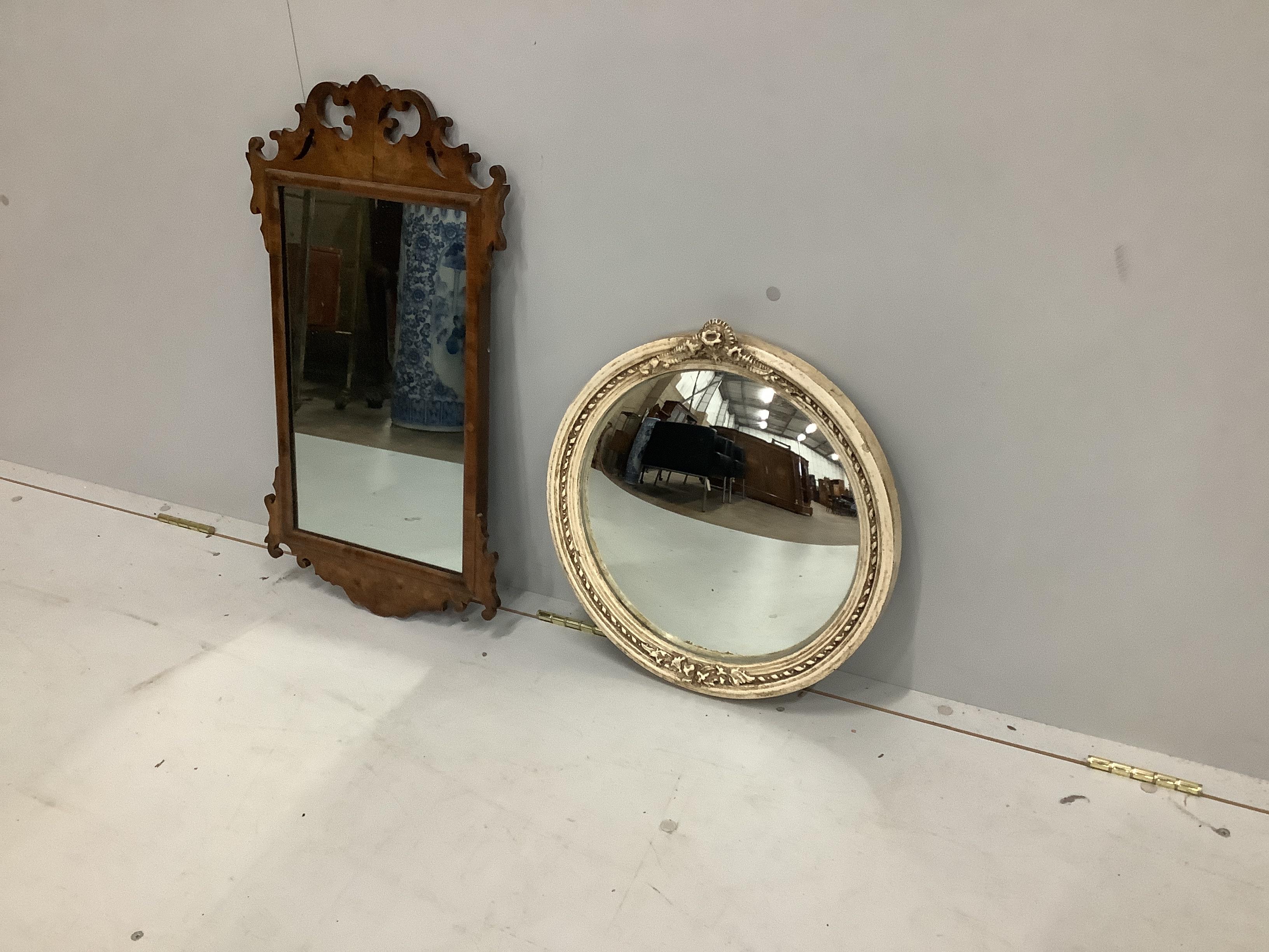 An 18th century style walnut fret cut wall mirror, width 37cm, height 67cm together with a circular convex wall mirror                                                                                                      