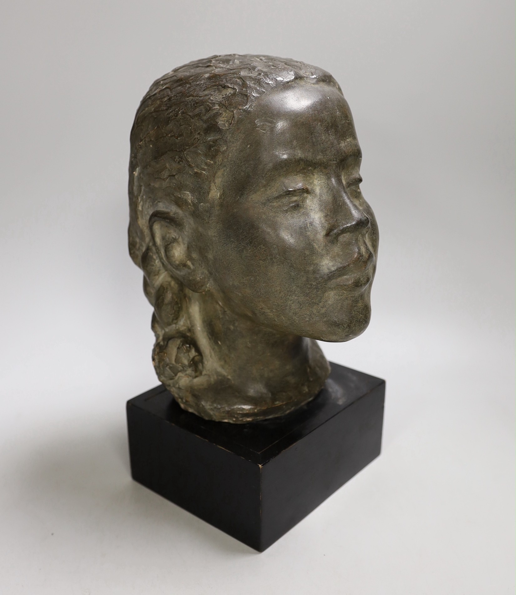 A terracotta bust of a girl on mount. 29cm tall overall                                                                                                                                                                     