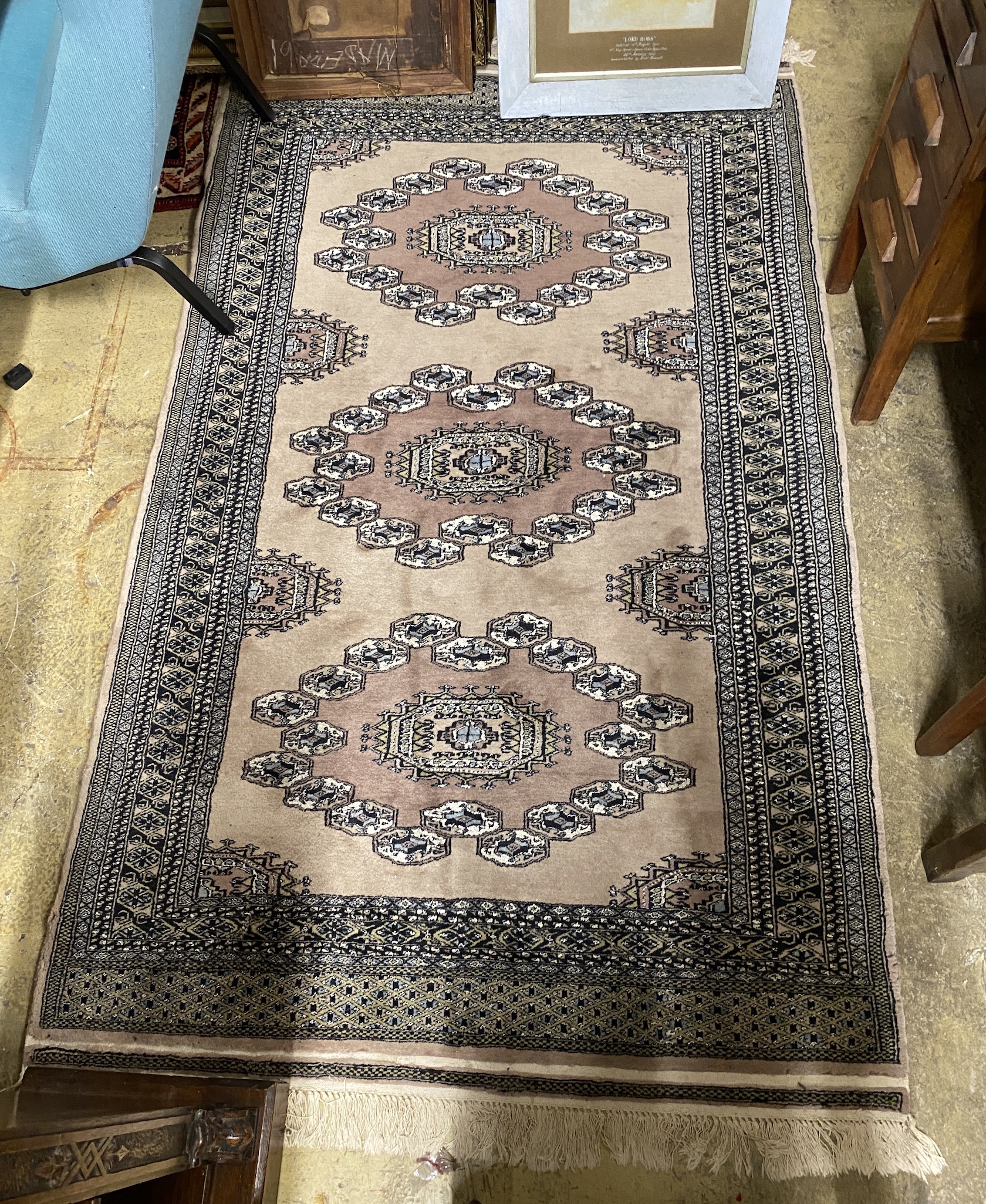 A Bokhara fawn ground rug, 210 x 124cm                                                                                                                                                                                      