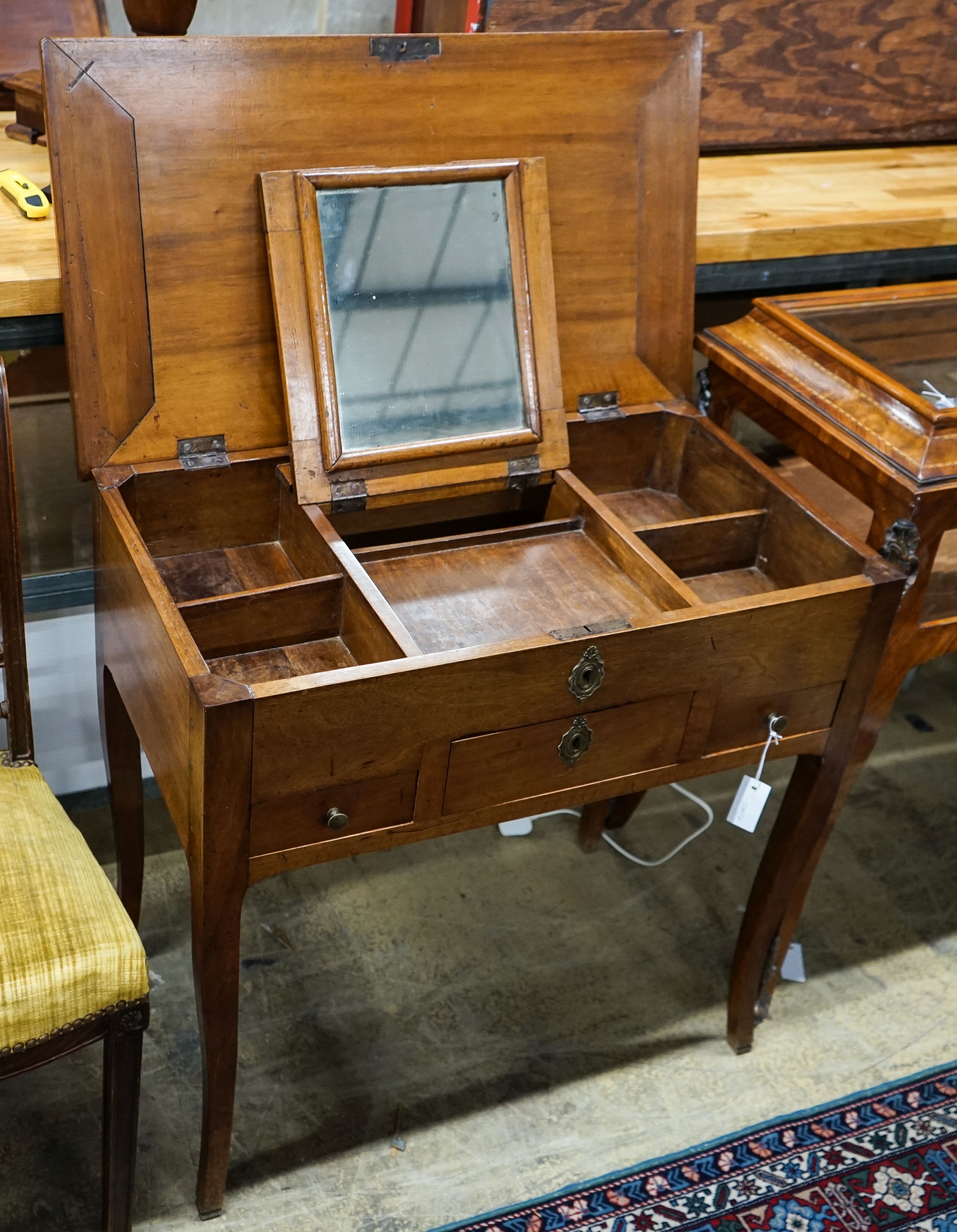 A 19th century French fruitwood enclosed dressing table with rectangular hinged top, width 78cm, depth 45cm, height 76cm                                                                                                    