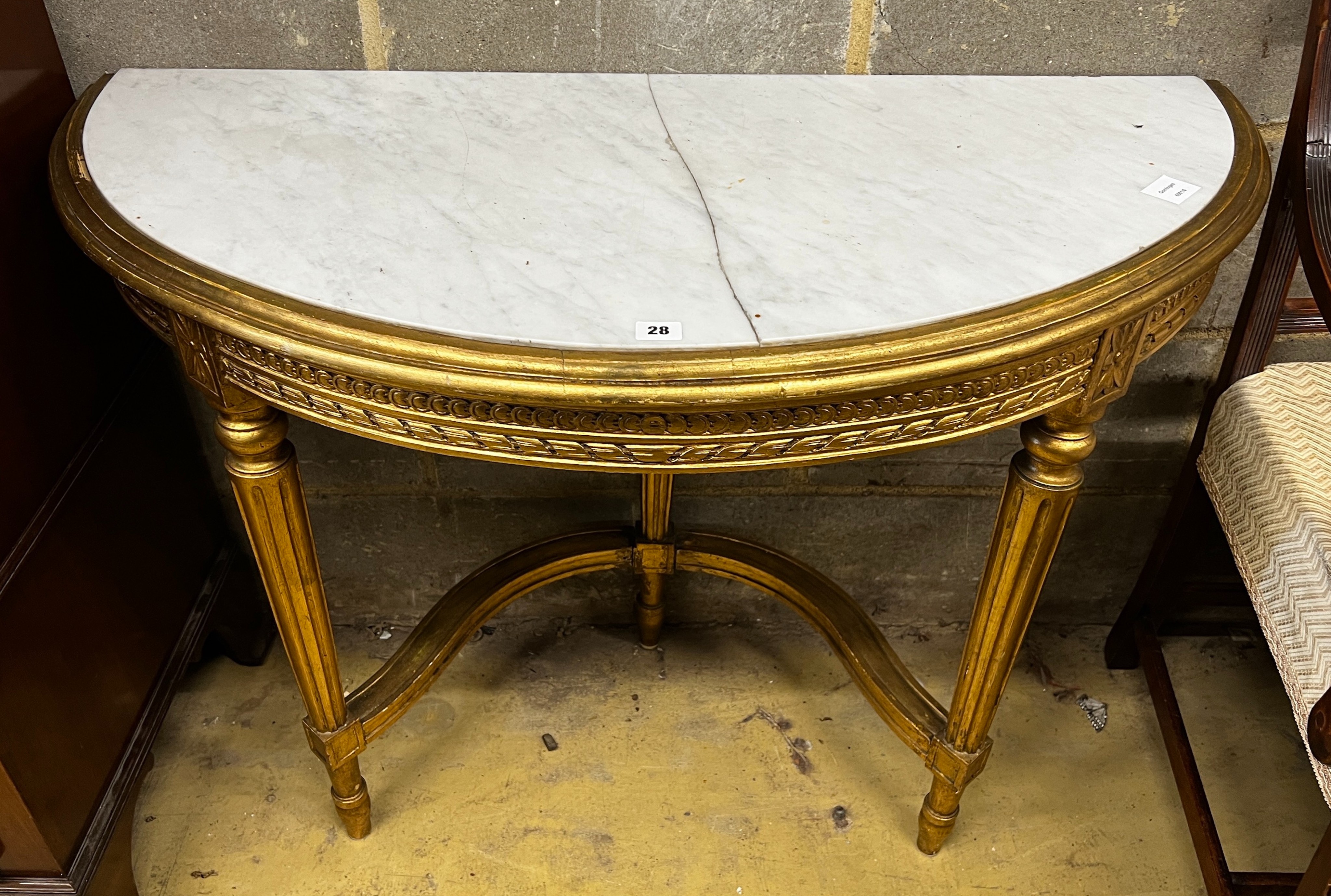 A Louis XVI style carved giltwood marble top D shaped console table, width 110cm, depth 50cm, height 73cm                                                                                                                   