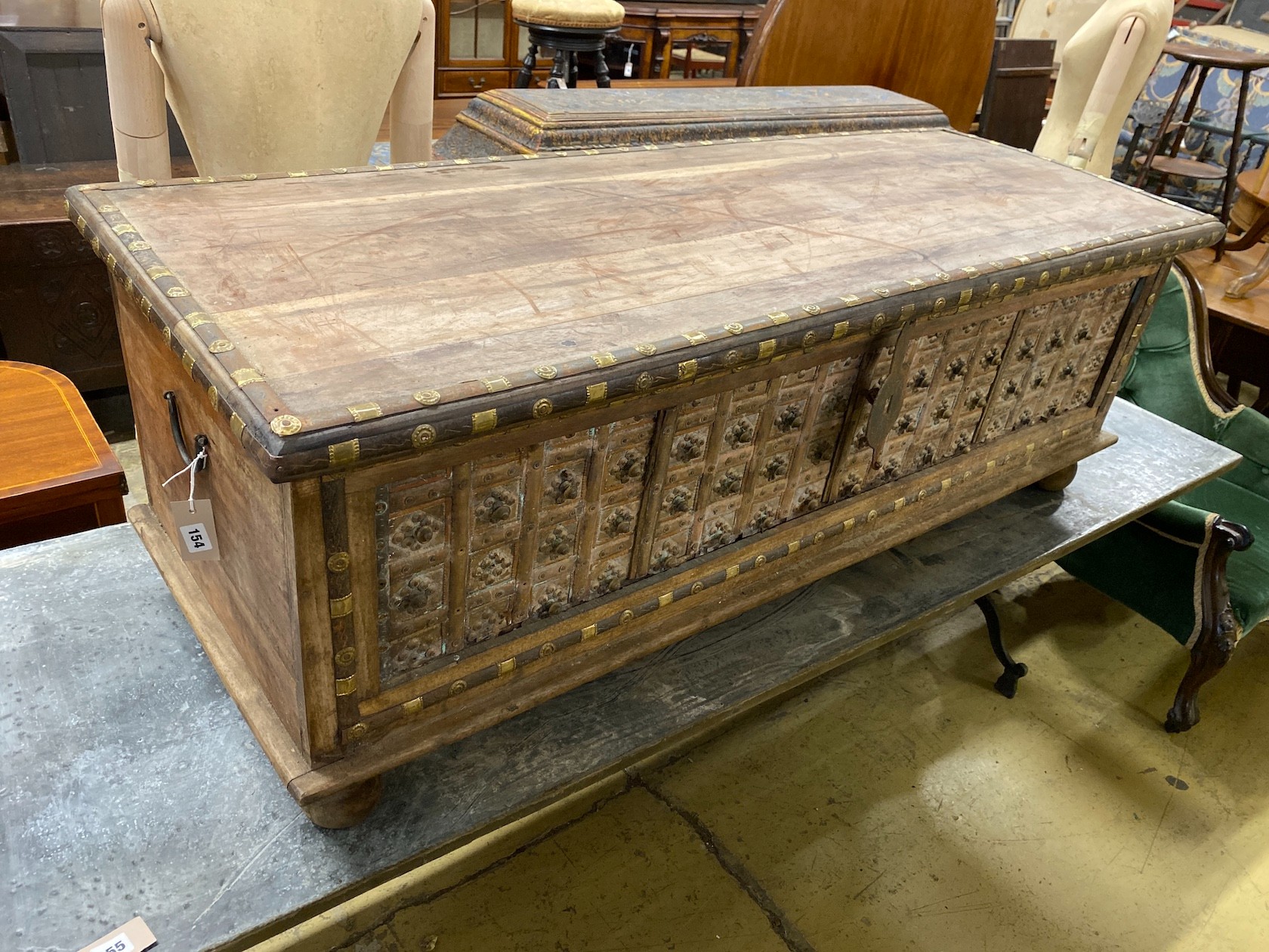 A South Asian brass mounted carved hardwood coffer, length 145cm, depth 55cm, height 50cm                                                                                                                                   