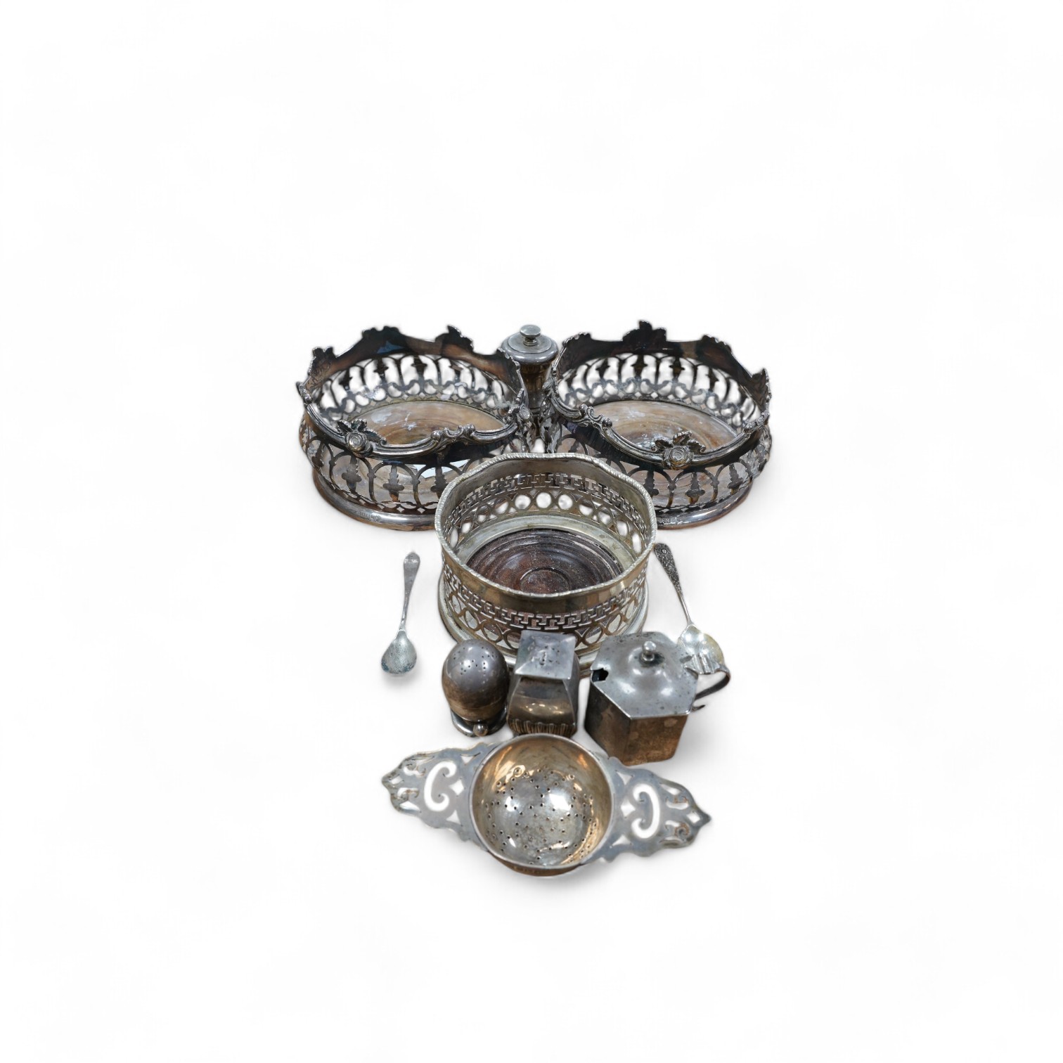 A pair of Victorian silver plated coasters, diameter 13.1cm, together with one other plated wine coaster and sundry small silver, including three condiments, a tea strainer and assorted flatware. Condition - poor to fair