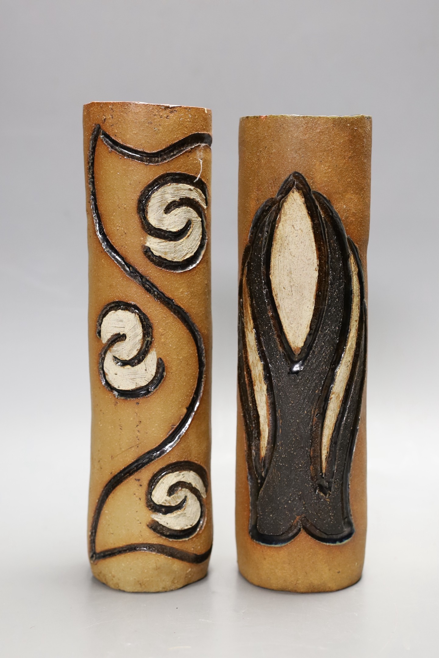 A pair of partially glazed stoneware cylindrical vases, circa 1970, 25cm high                                                                                                                                               
