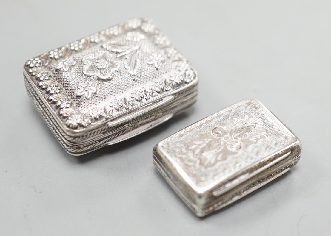 A George IV silver vinaigrette, embossed with flowers and flower heads, Ledsam & Vale?, Birmingham, 1820, 25mm and one other smaller Victorian silver vinaigrette, by Edward Smith.                                         