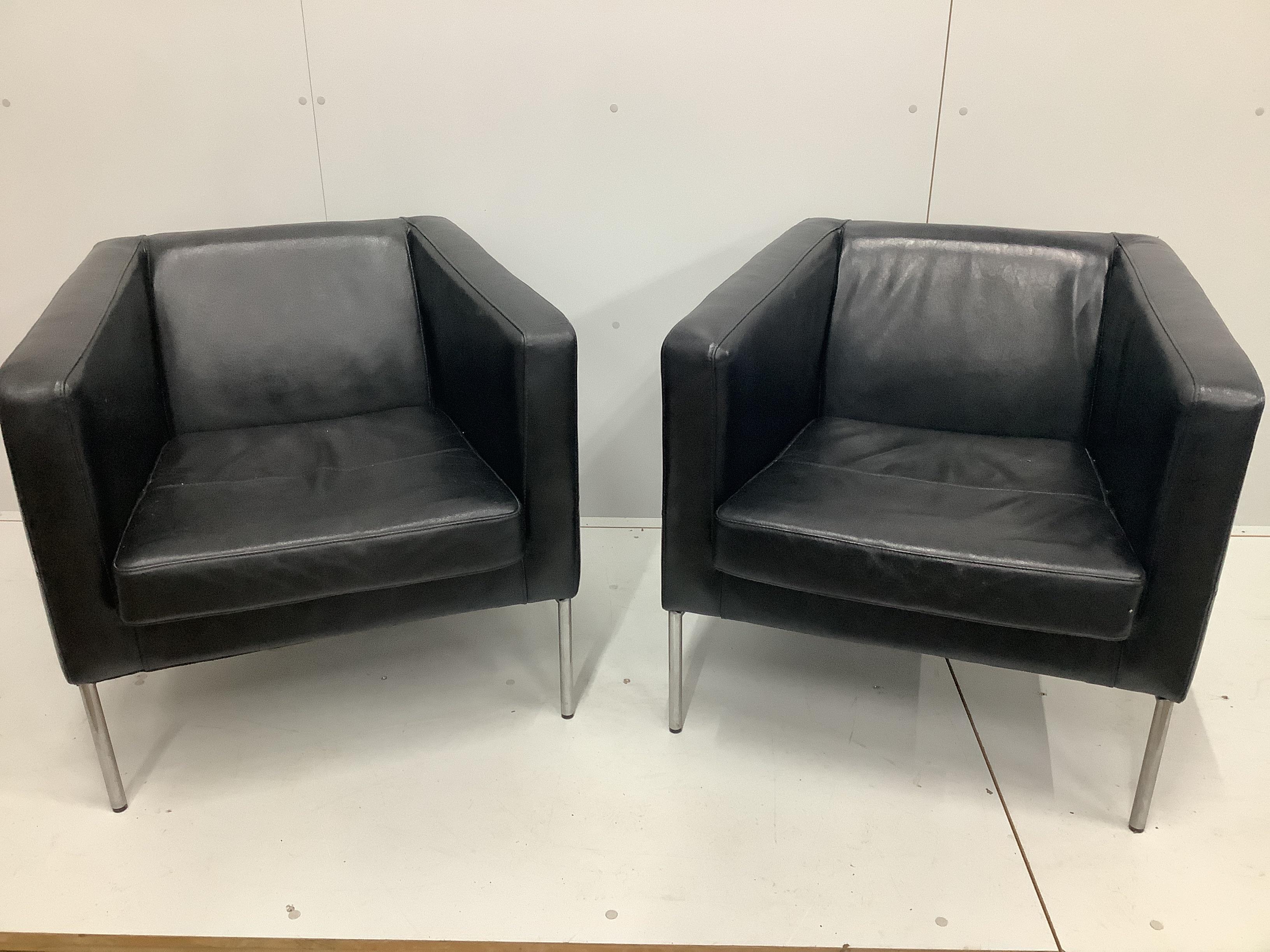 A pair of contemporary black leather armchairs, width 77cm, depth 69cm, height 72cm                                                                                                                                         