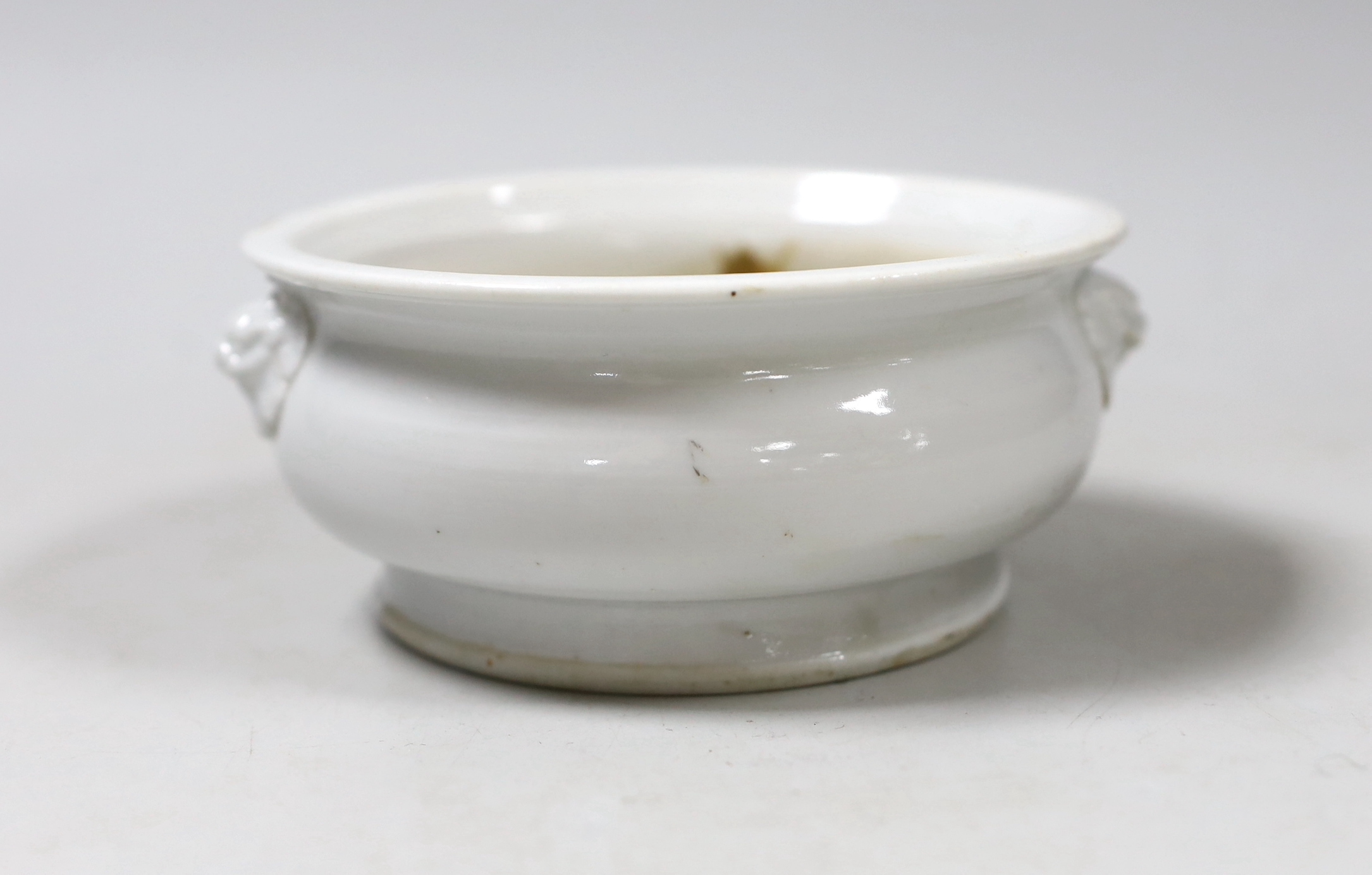 A Chinese blanc de chine two-handled censer, 12.5cm diameter                                                                                                                                                                