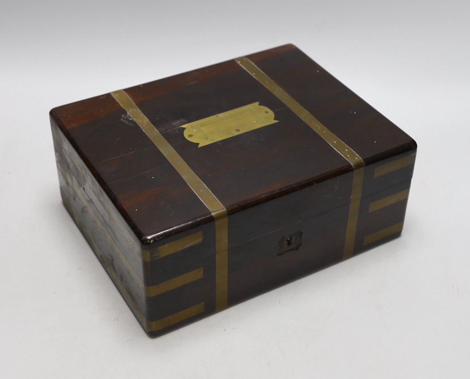 A Victorian rosewood brass bound toilet box, with contents, 21cms deep x 27cms wide                                                                                                                                         