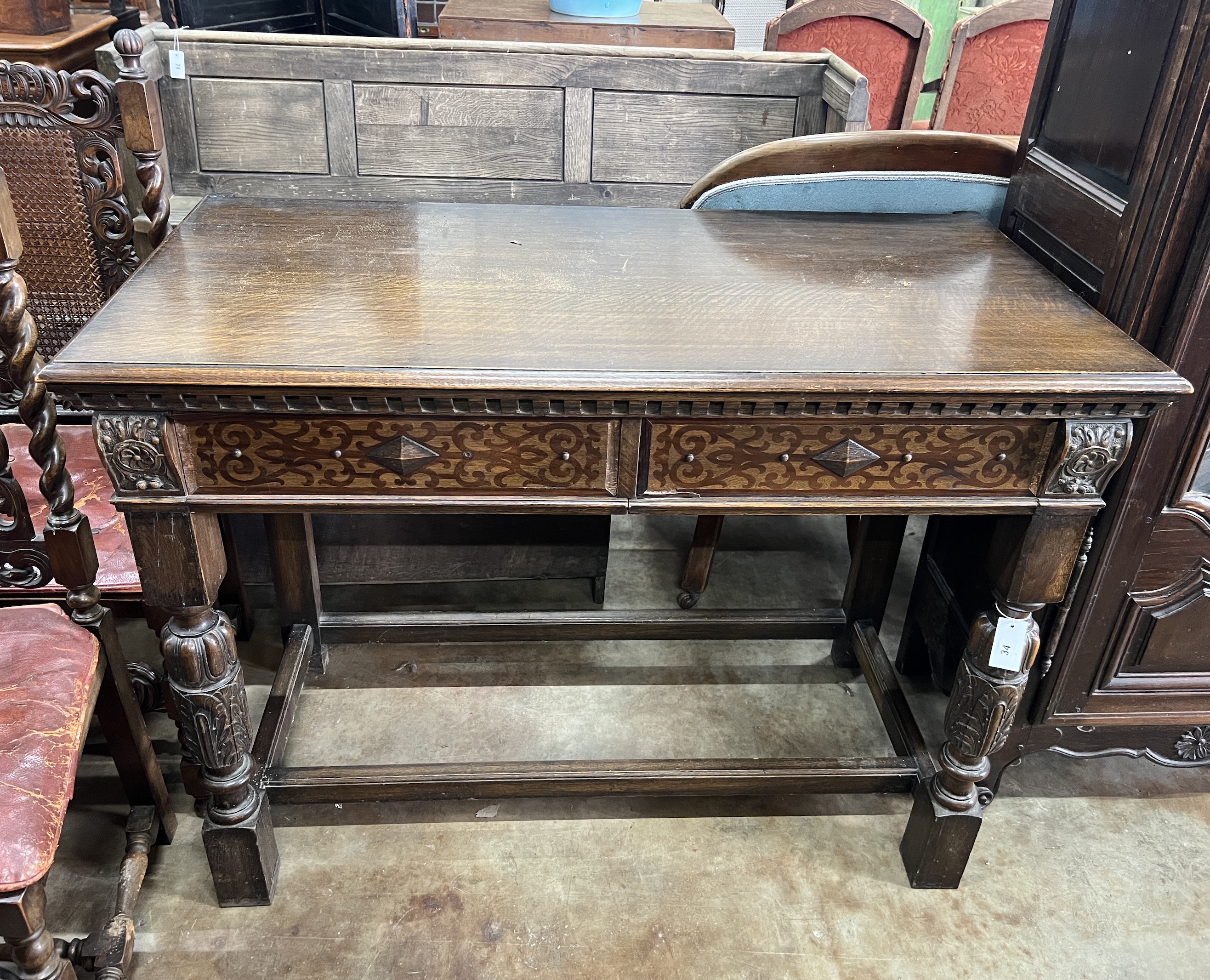 An 18th century style oak two drawer serving table, width 122cm, depth 61cm, height 92cm                                                                                                                                    