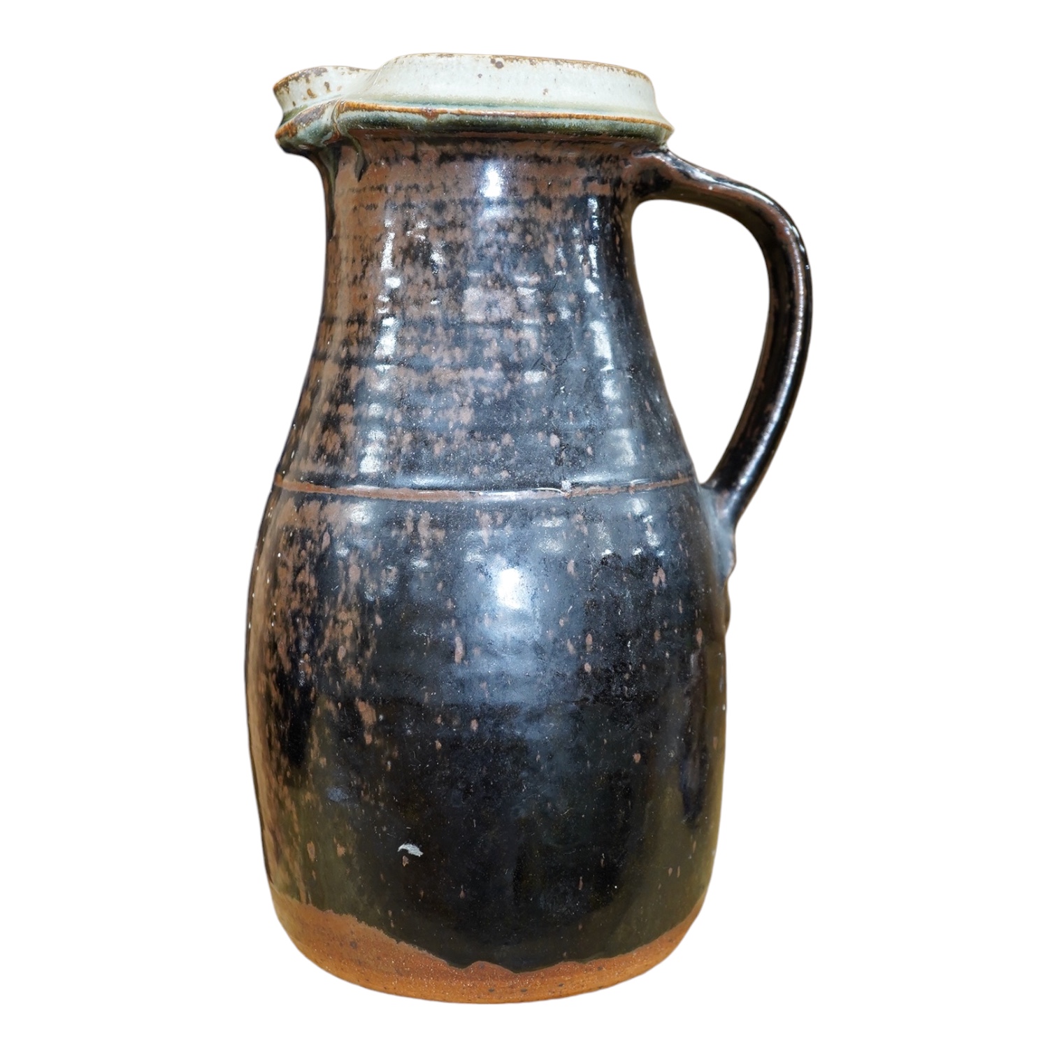 Richard Batterham (1936-2021), a tall Stoneware black glazed jug, with a cream rim, 28cm high. Condition - good                                                                                                             