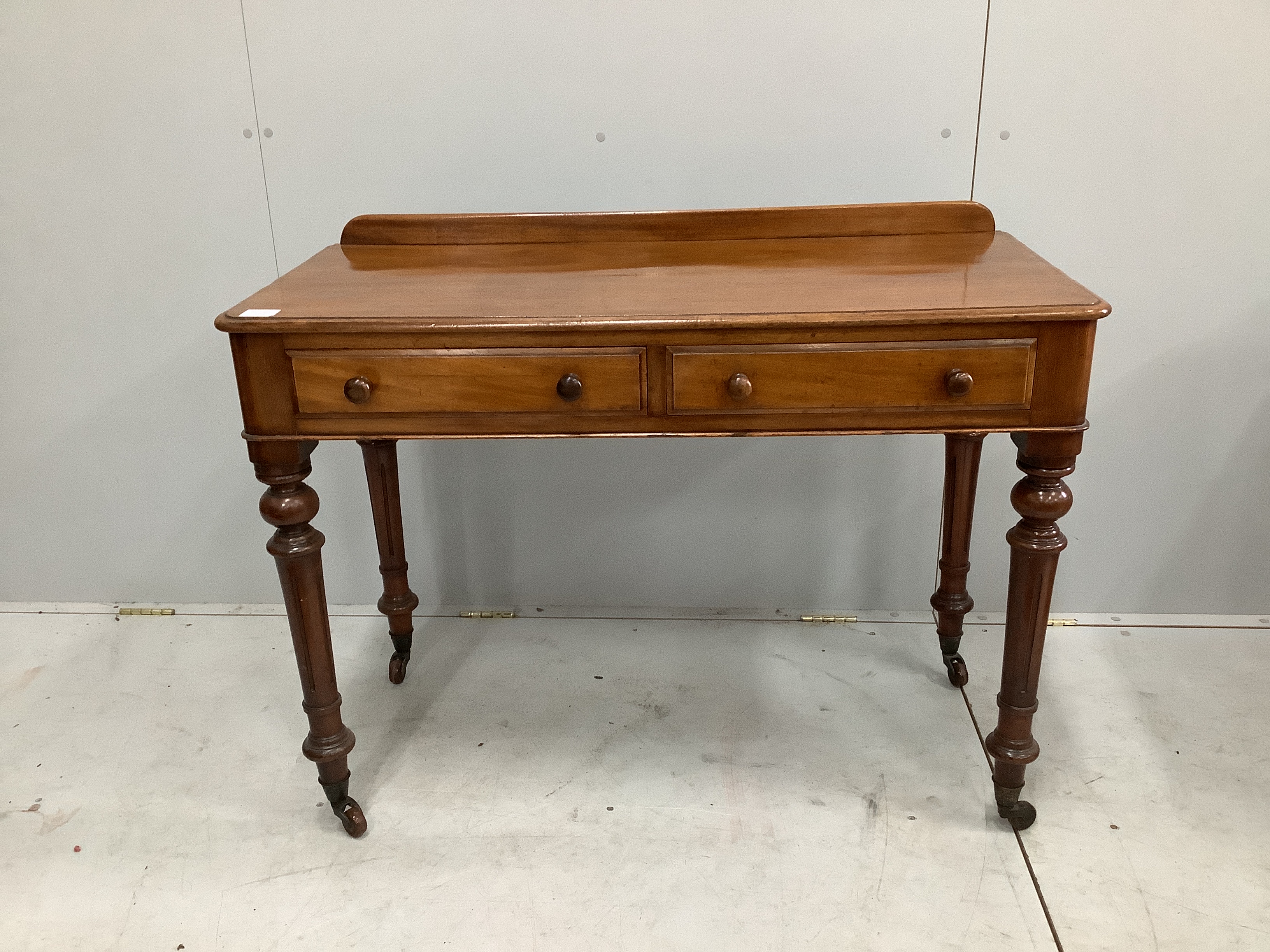 A Victorian mahogany two drawer side table, width 106cm, depth 49cm, height 80cm                                                                                                                                            