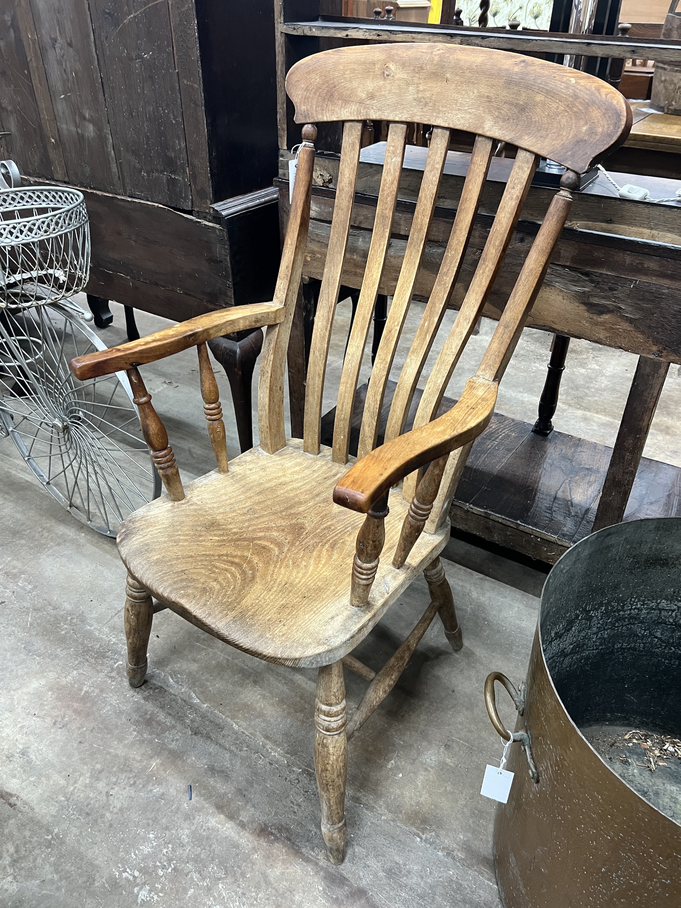 A Victorian elm and beech Windsor lathe back armchair, width 54cm, depth 47cm, height 110cm                                                                                                                                 