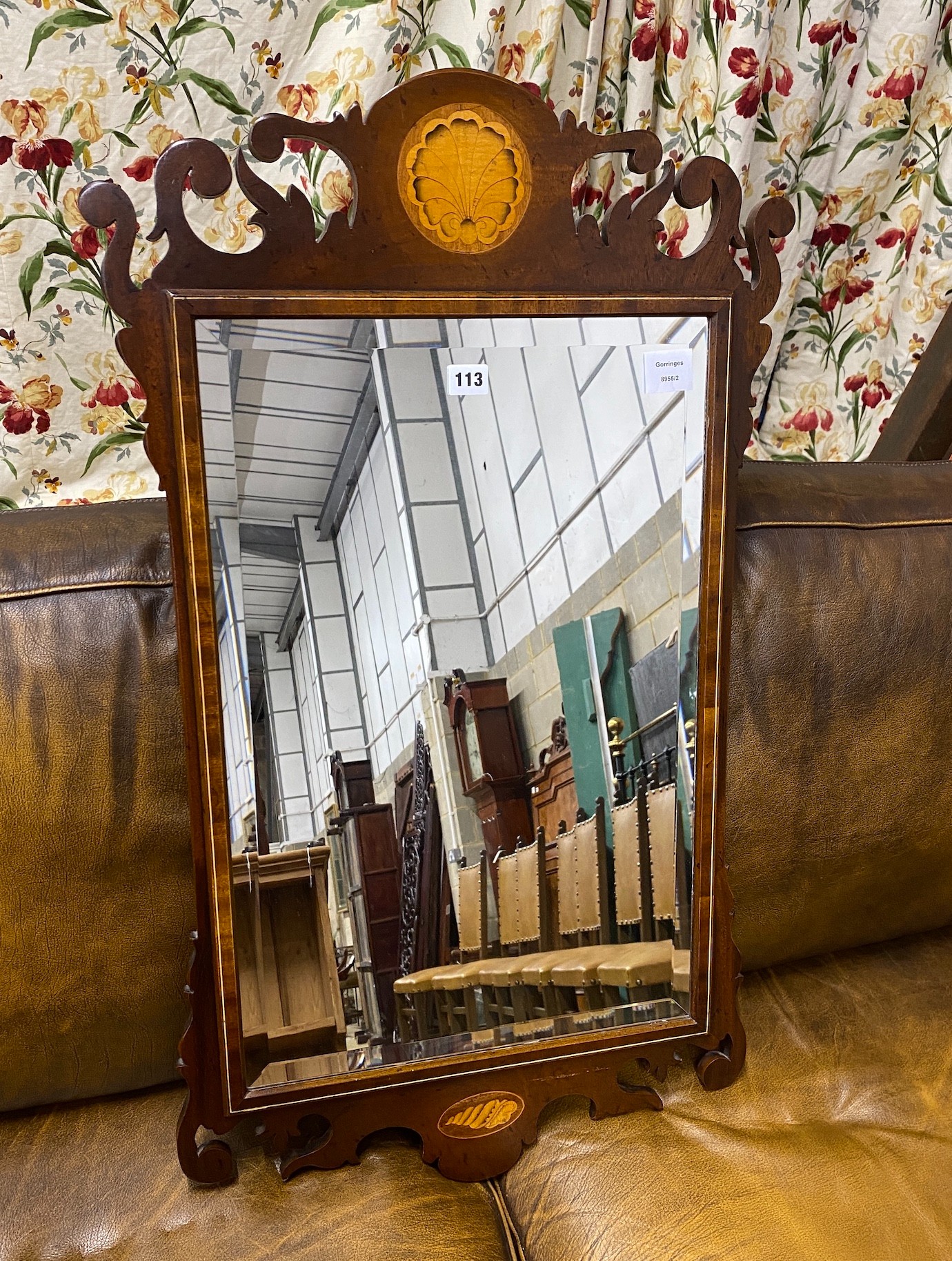 A George III style shell inlaid mahogany fret cut wall mirror, width 52cm, height 91cm                                                                                                                                      