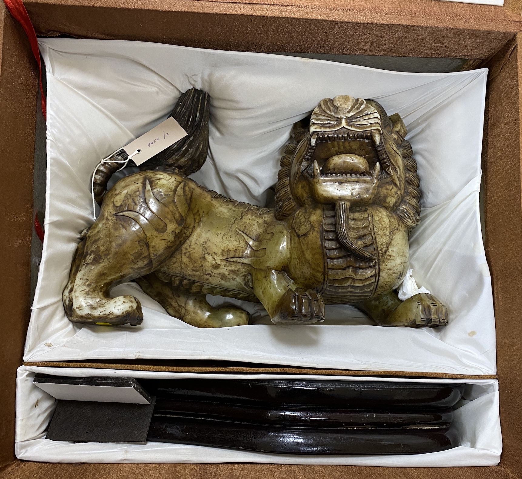 A massive Chinese soapstone figure of a lion-dog, 43cm wide (excl. stand), boxed                                                                                                                                            