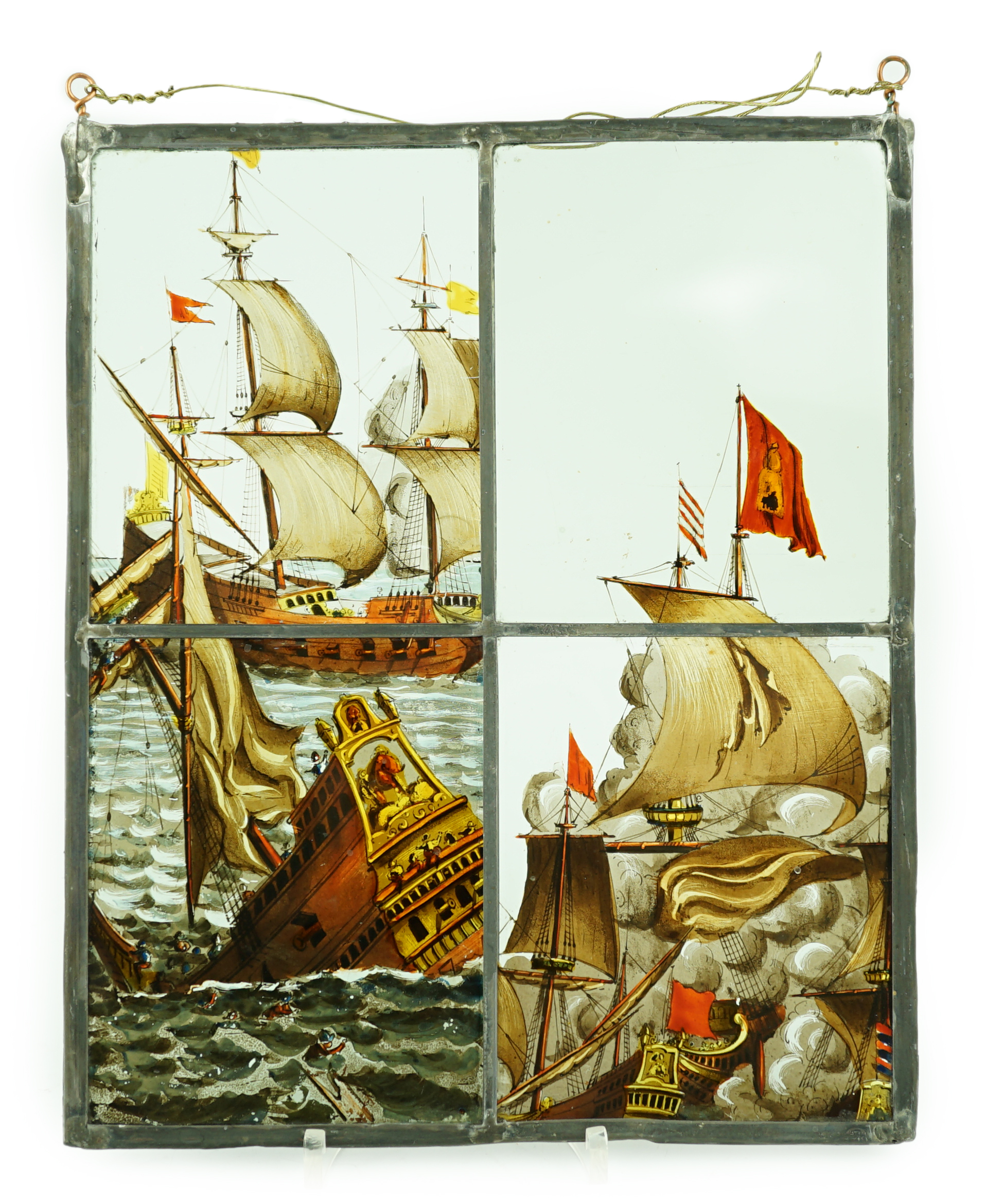 A 18th century Dutch stained glass panel made from four sections depicting a shipwreck and the sails of a fighting galleon, overall 28 x 23cm                                                                               