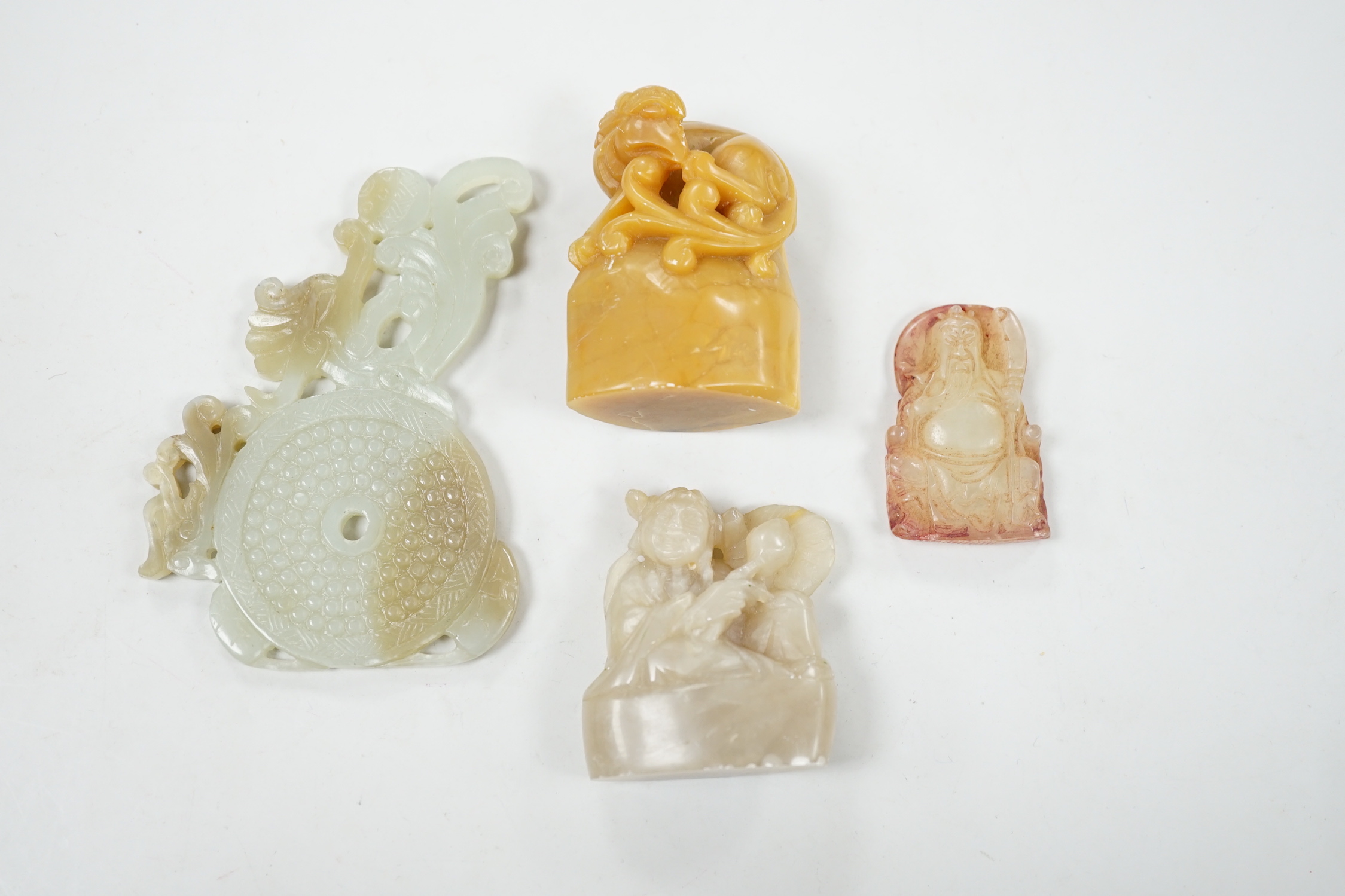 A collection of Chinese jade and soapstone carvings, largest a carved panel 11cm long                                                                                                                                       