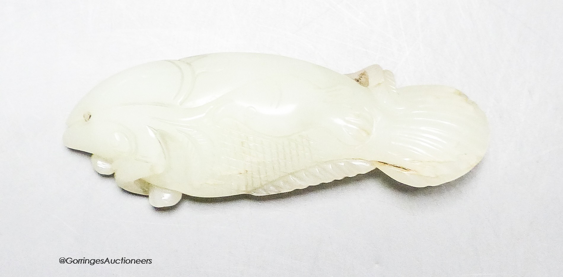 A Chinese pale celadon jade carving of a fish, 8.7 cm                                                                                                                                                                       