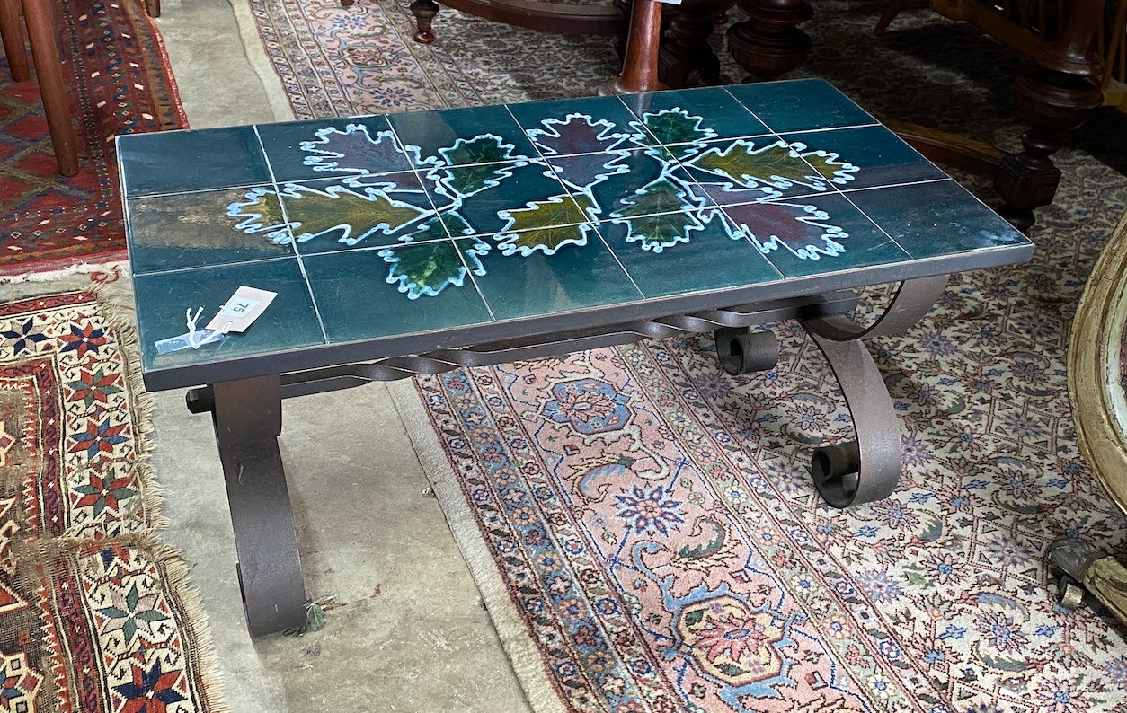 A 1970's wrought iron tile top coffee table, length 90cm, depth 45m, height 42cm                                                                                                                                            
