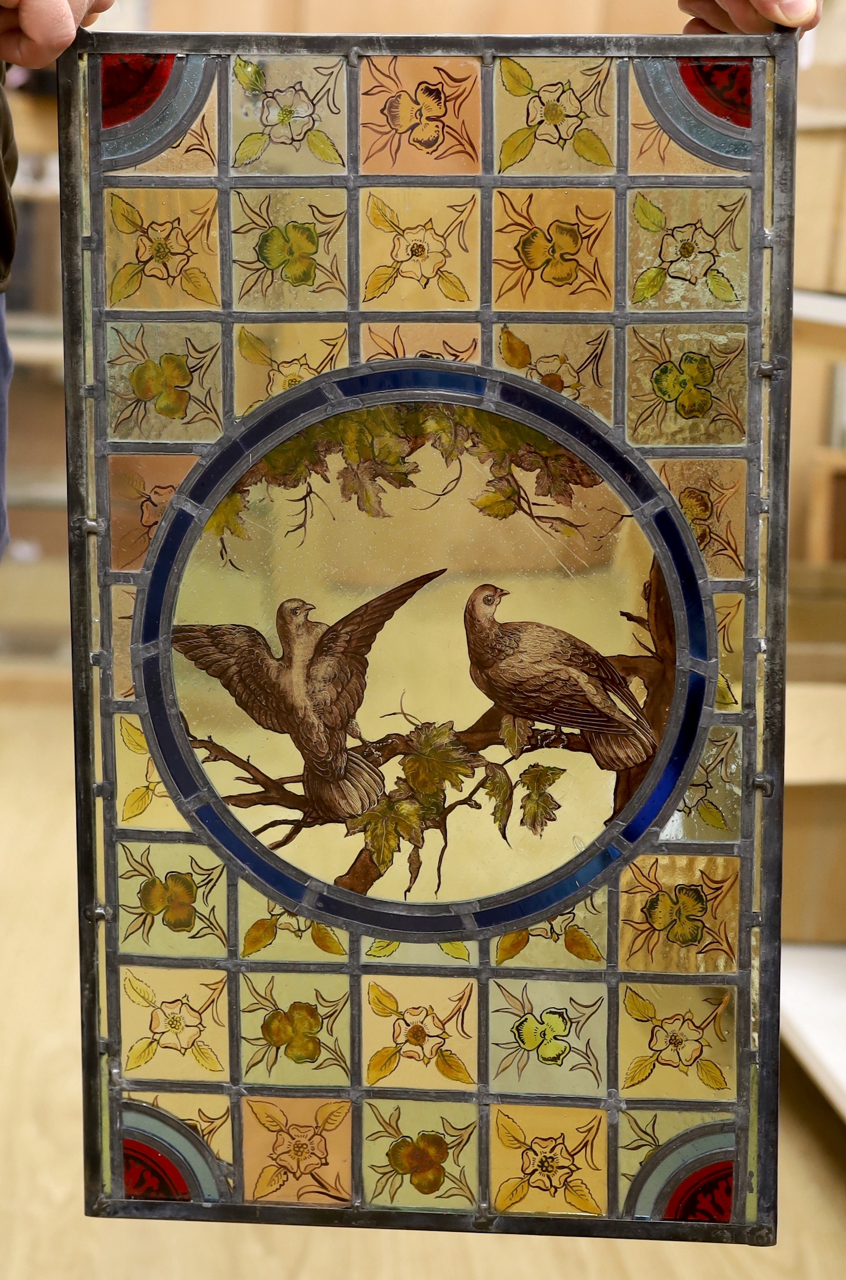 A Victorian 'two birds’ stained glass panel, 35cm wide x 59.5cm high                                                                                                                                                        