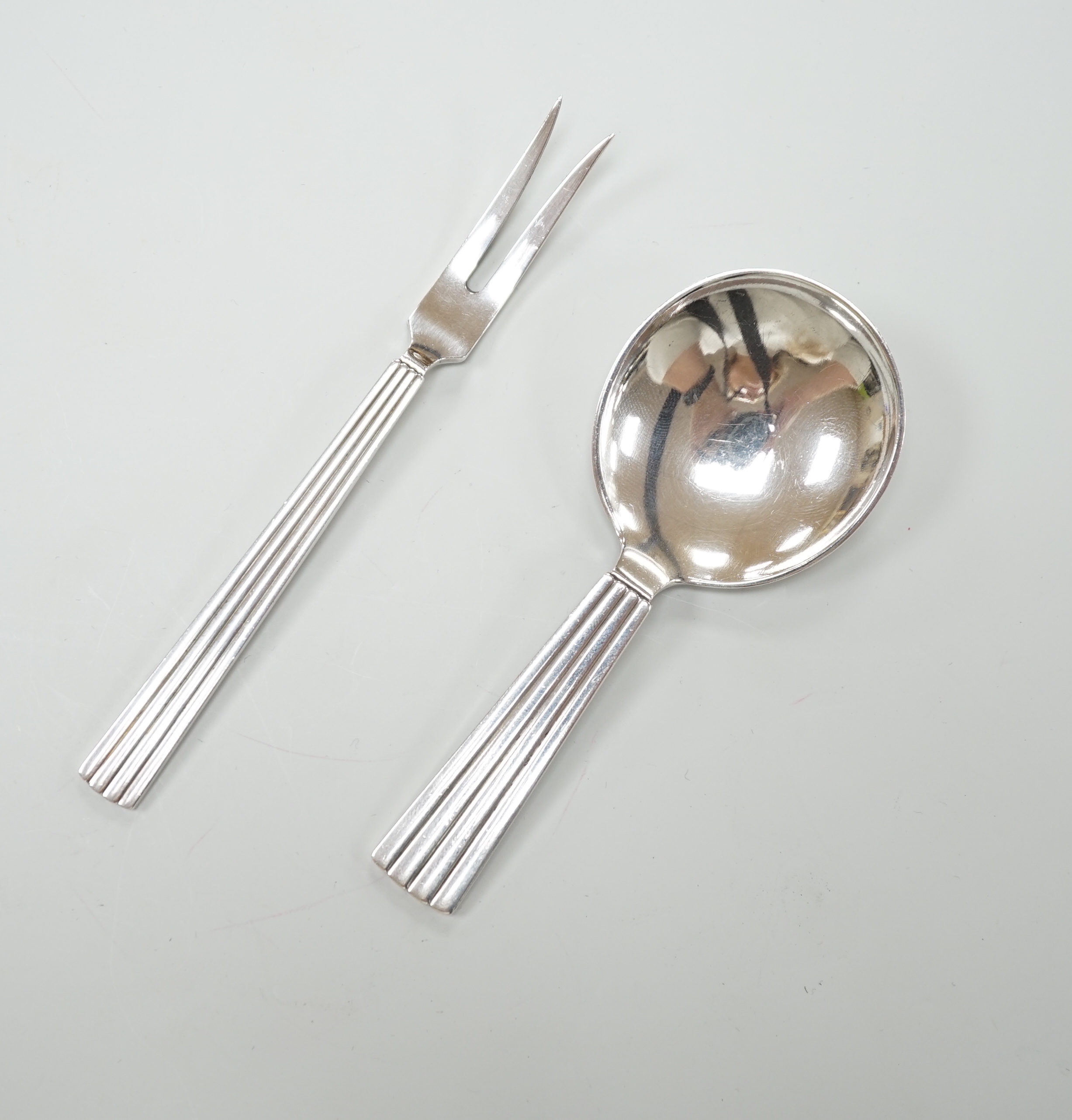 A Georg Jensen sterling christening spoon and fork set, 1945-1951 Sigvard Bernadotte design, not import marked, with associated box                                                                                         