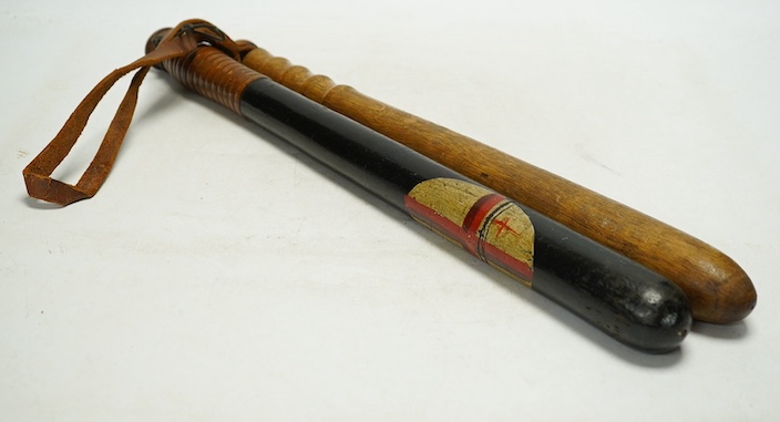 Two early 20th century truncheons, one painted with the Saint Georges Cross, 46cm. Condition - fair to good                                                                                                                 