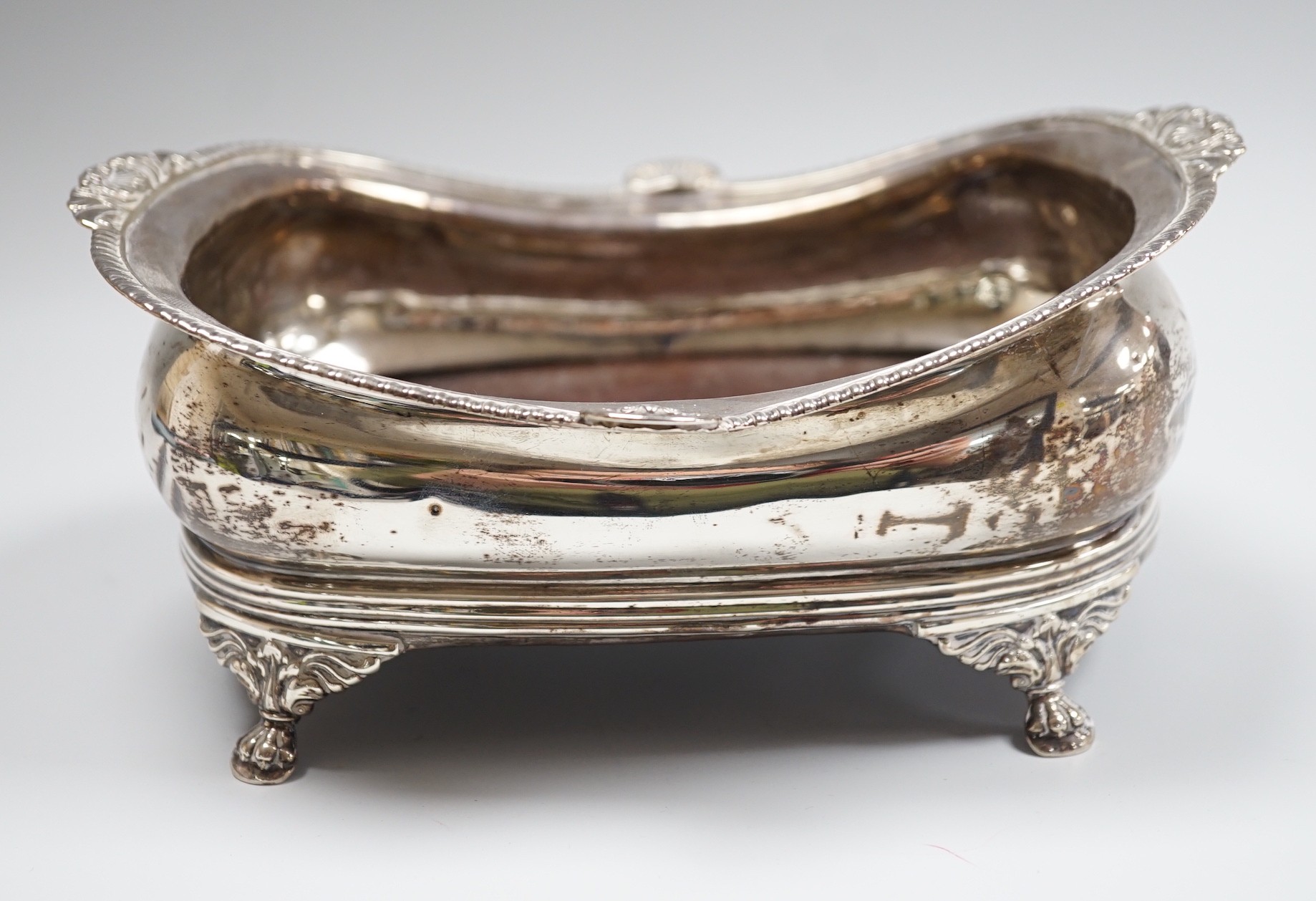 A George III silver mounted cruet stand, no handle and no bottles, marks rubbed, 20.cm.                                                                                                                                     
