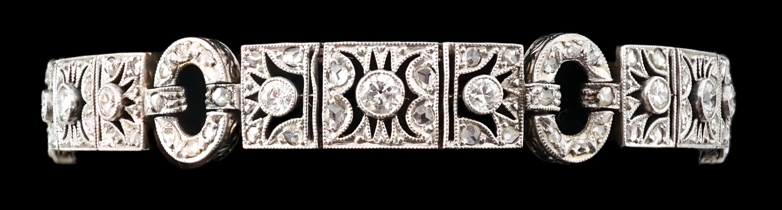 A 1920's pierced 18ct white gold and millegrain set round and rose cut diamond cluster bracelet                                                                                                                             