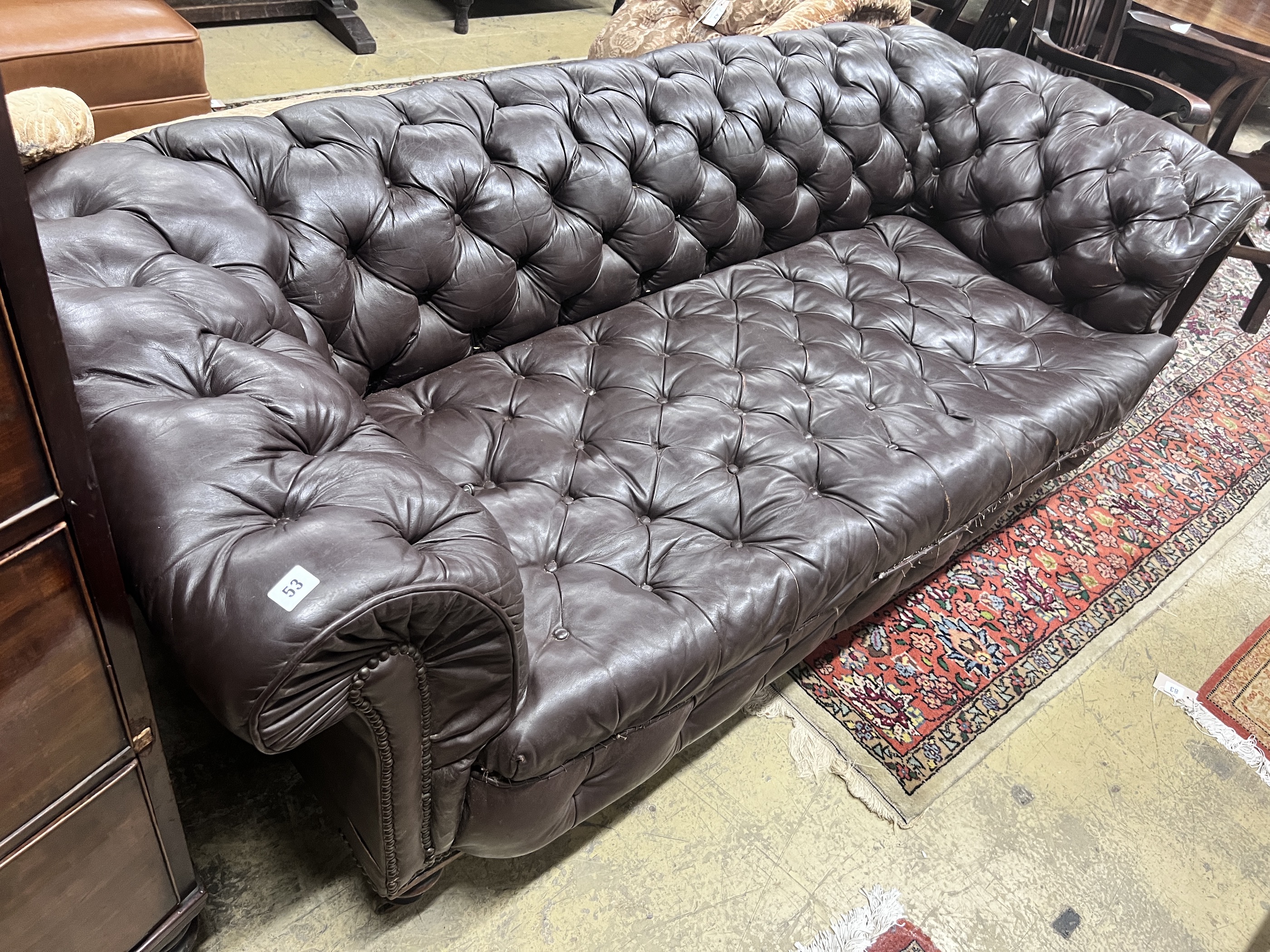 A Victorian buttoned brown leather Chesterfield settee, length 200cm, width 84cm, height 68cm                                                                                                                               