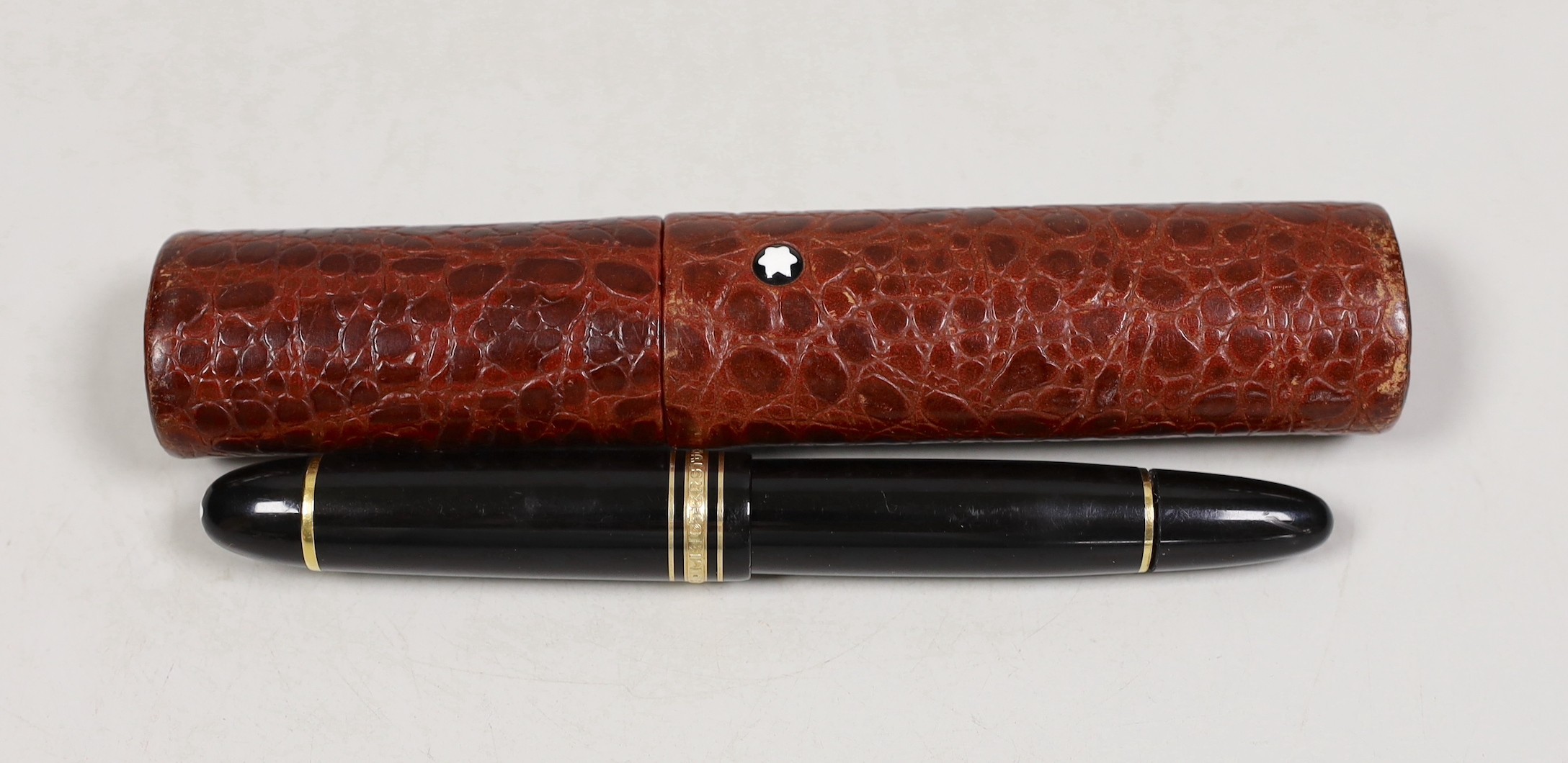 A Montblanc Meisterstuck no.149 fountain pen and a red crocodile pattern leather case                                                                                                                                       