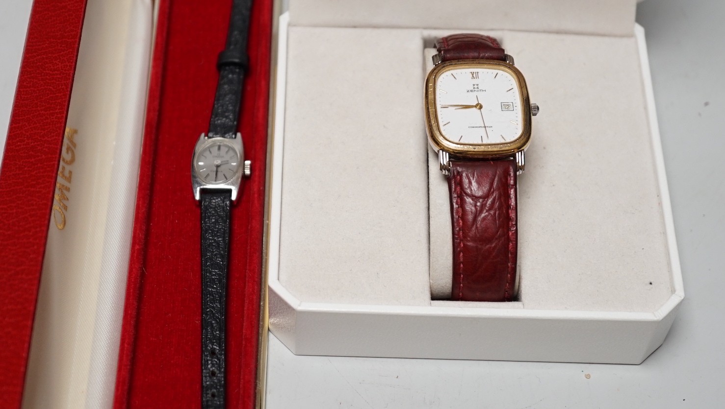 A gentleman's steel and gold plated Zenith Cosmopolitan wrist watch and a lady's Omega steel wrist watch.                                                                                                                   