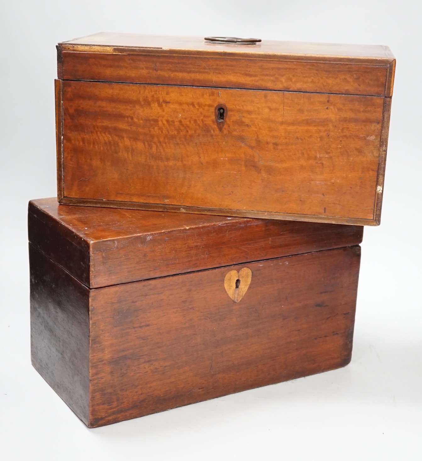 A late George III satinwood inlaid tea caddy and a later similar mahogany tea caddy, largest 30cms wide x 18cms high                                                                                                        