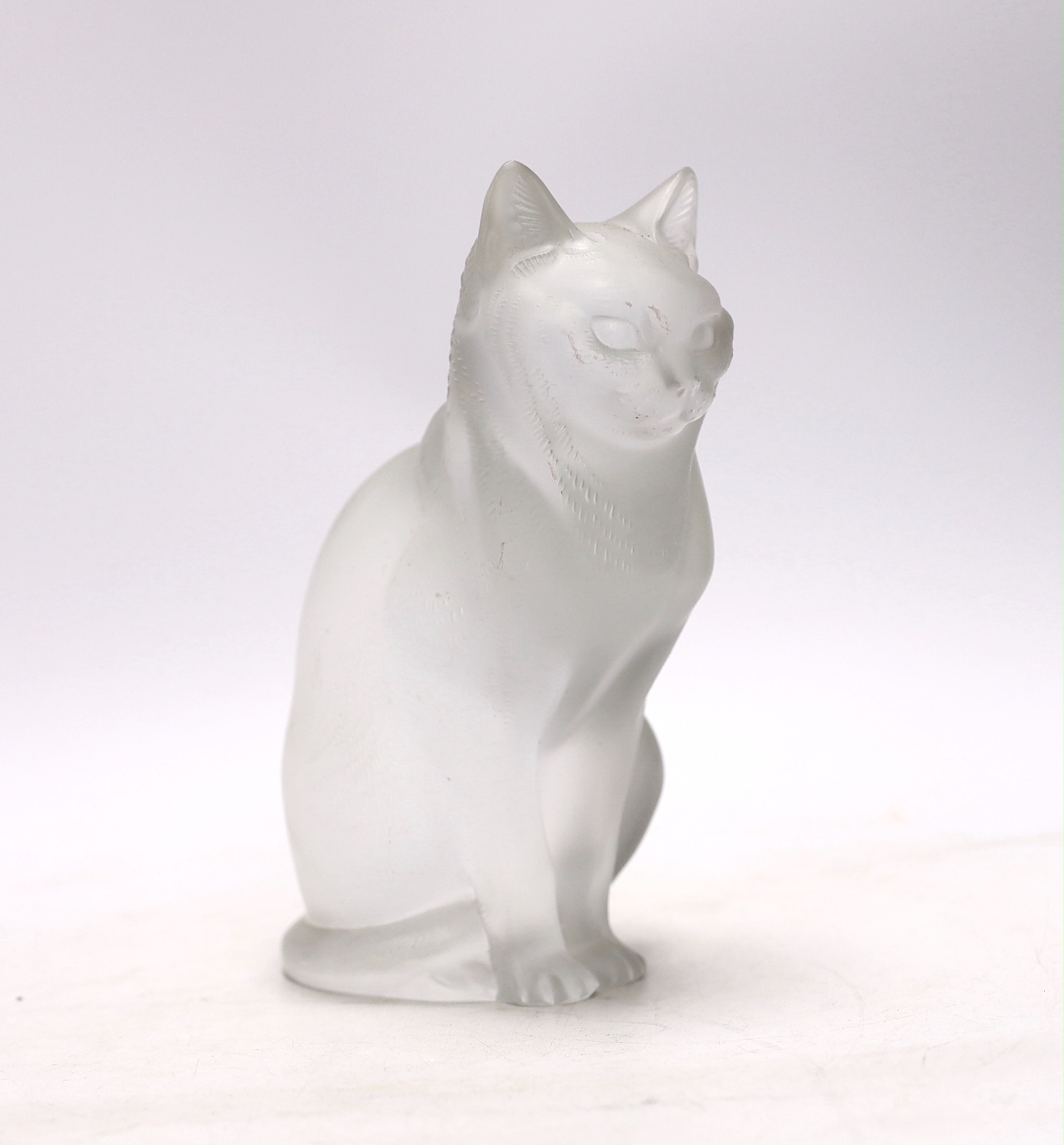 A Lalique glass seated cat, signed to the base, 20cm high                                                                                                                                                                   