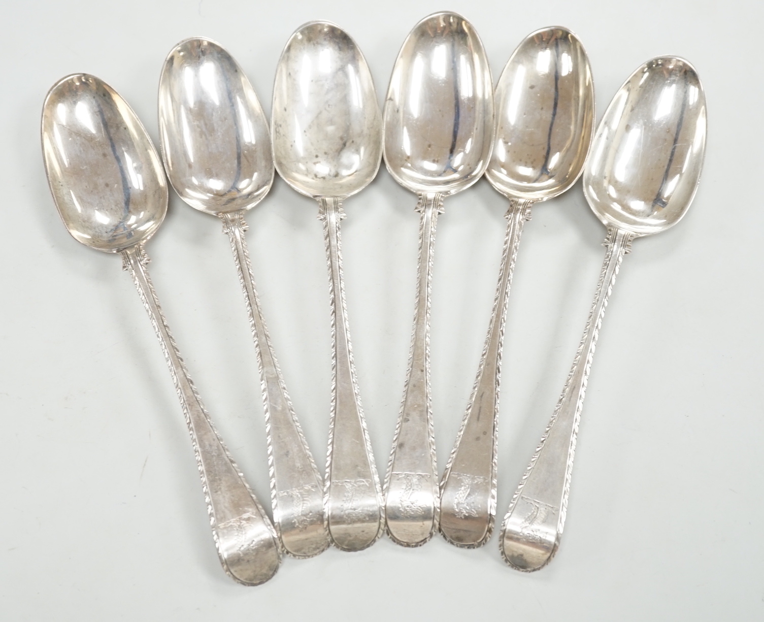 A set of six early George III silver Old English feather edge table spoons, Thompson Davis, London, 1764, 21.3cm, 12.6oz.                                                                                                   