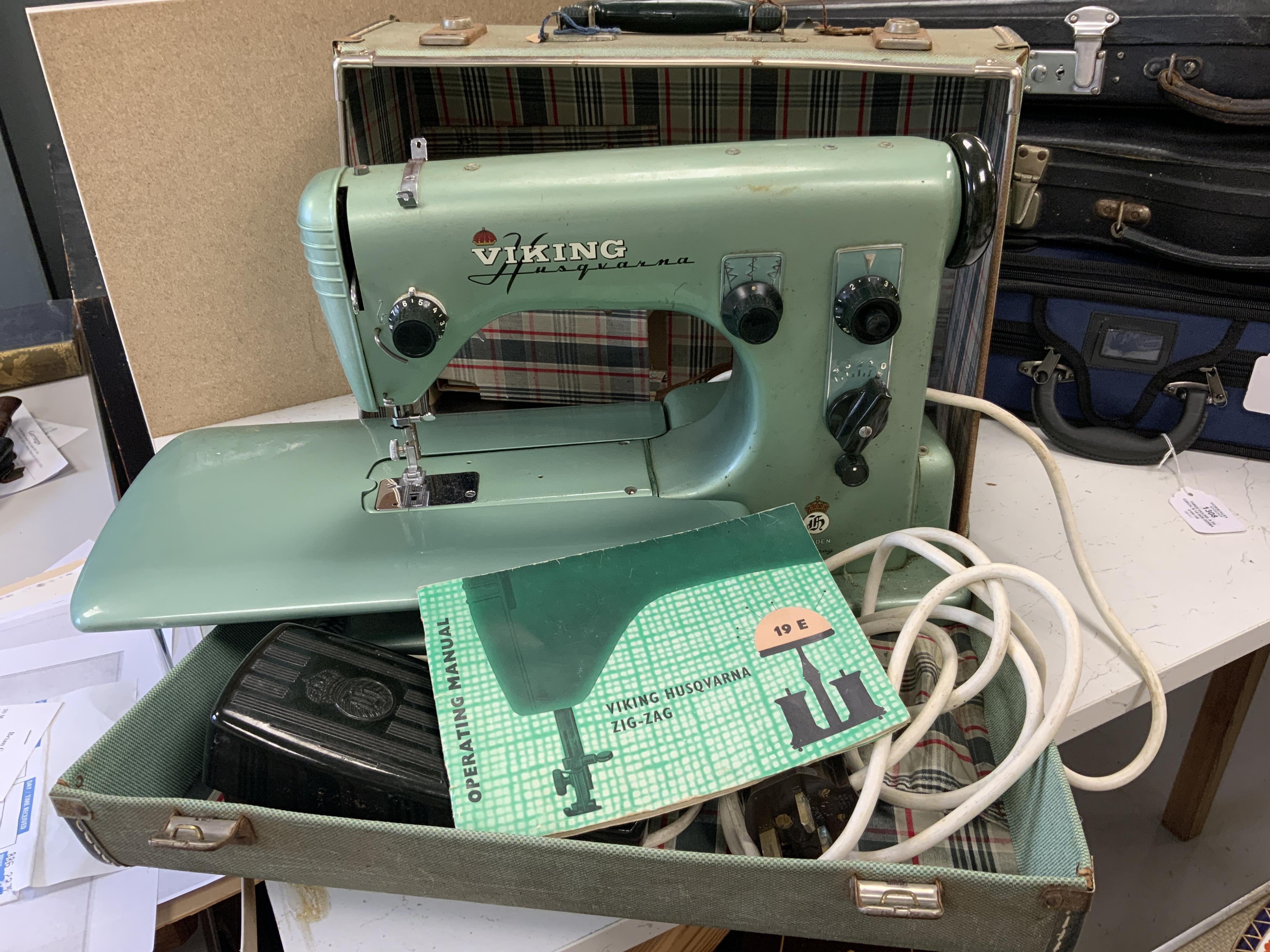 A Swedish 1950s/60s Viking Husqvarna Zig-Zag electric sewing machine, in original fitted case with instruction manual. Condition - fair to good.                                                                            