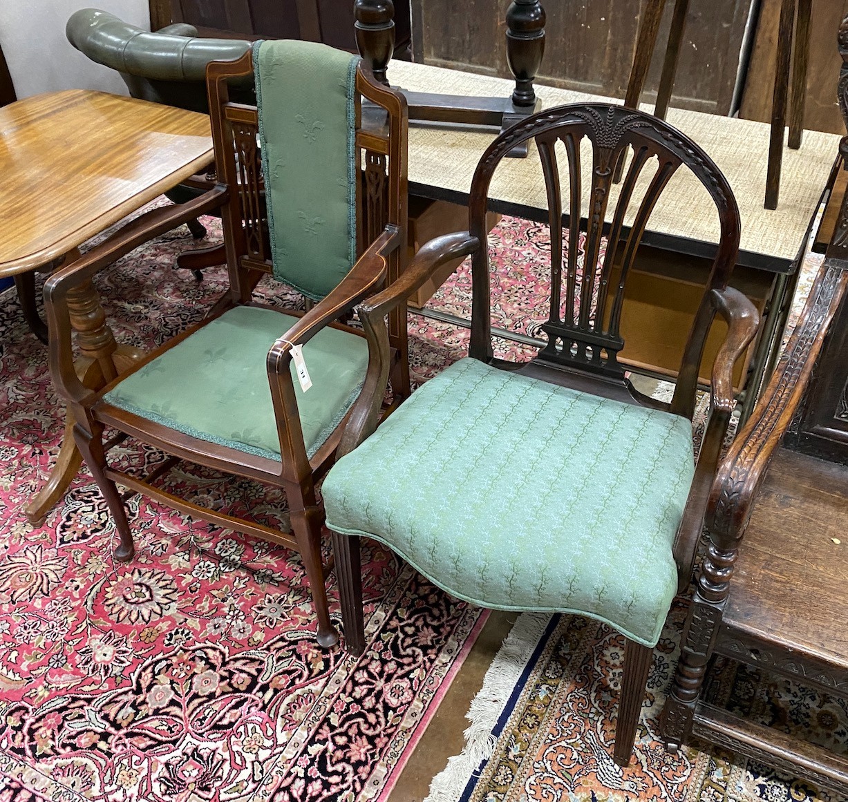 A George III mahogany inlaid elbow chair and an Edwardian mahogany elbow chair                                                                                                                                              