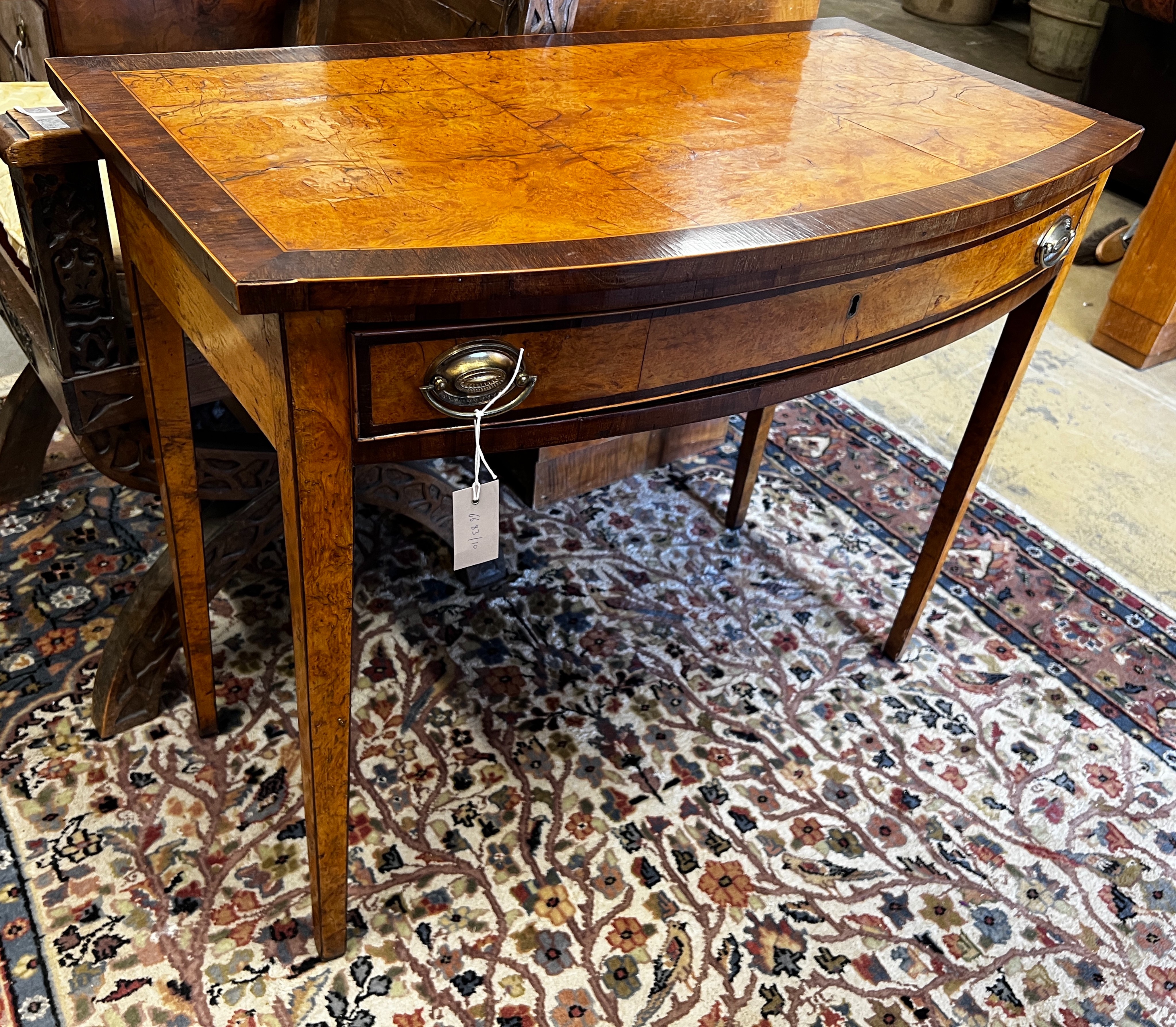 A George III rosewood banded bird's eye maple bowfront side table, width 91cm, depth 49cm, height 76cm                                                                                                                      