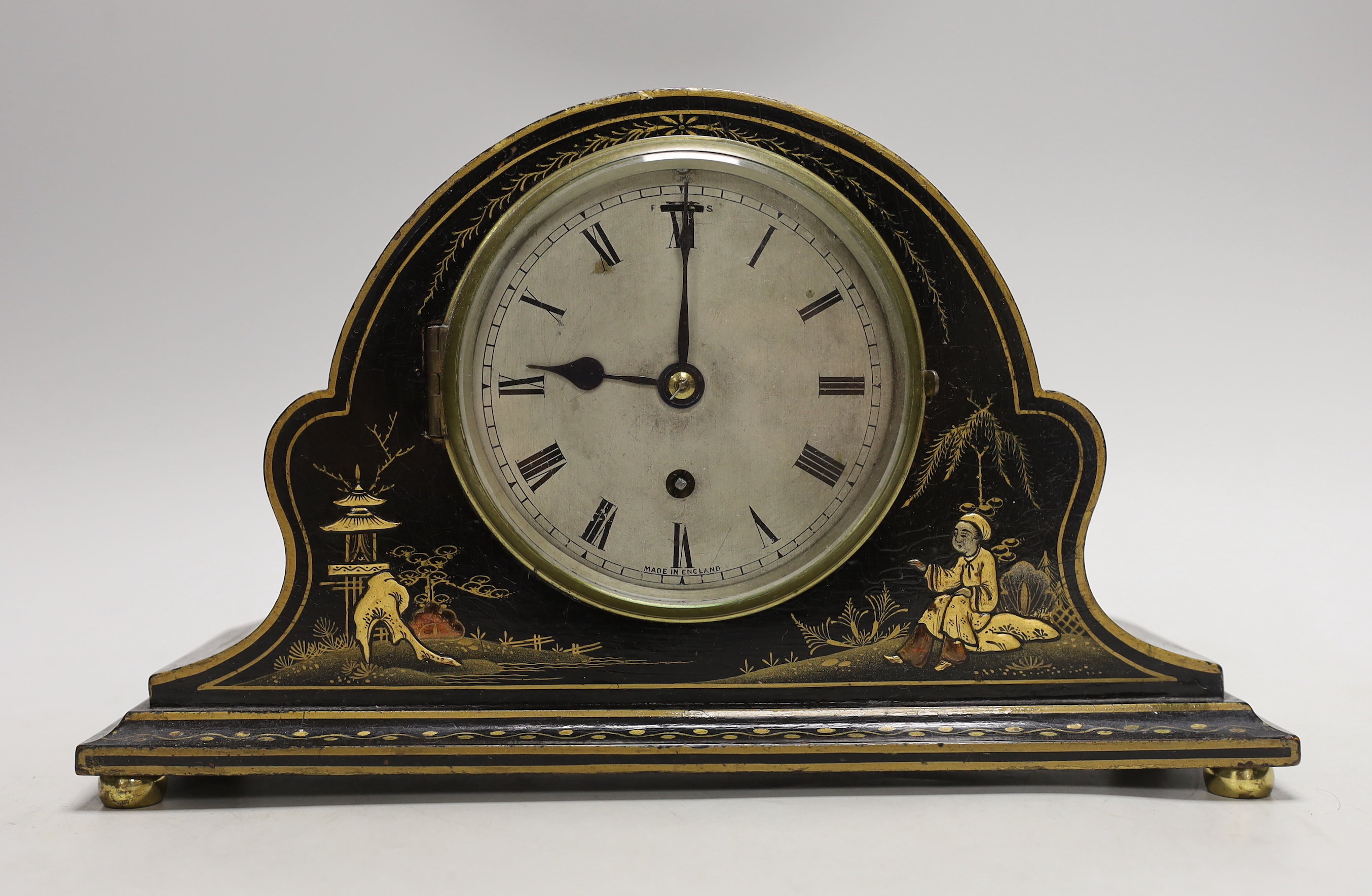 A black chinoiserie japanned mantel clock, 28cm wide                                                                                                                                                                        