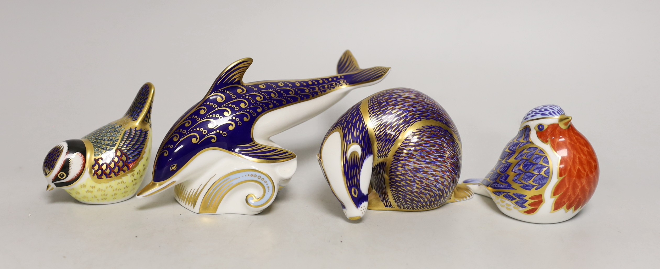Four Royal Crown Derby paperweights - dolphin, badger and two birds                                                                                                                                                         