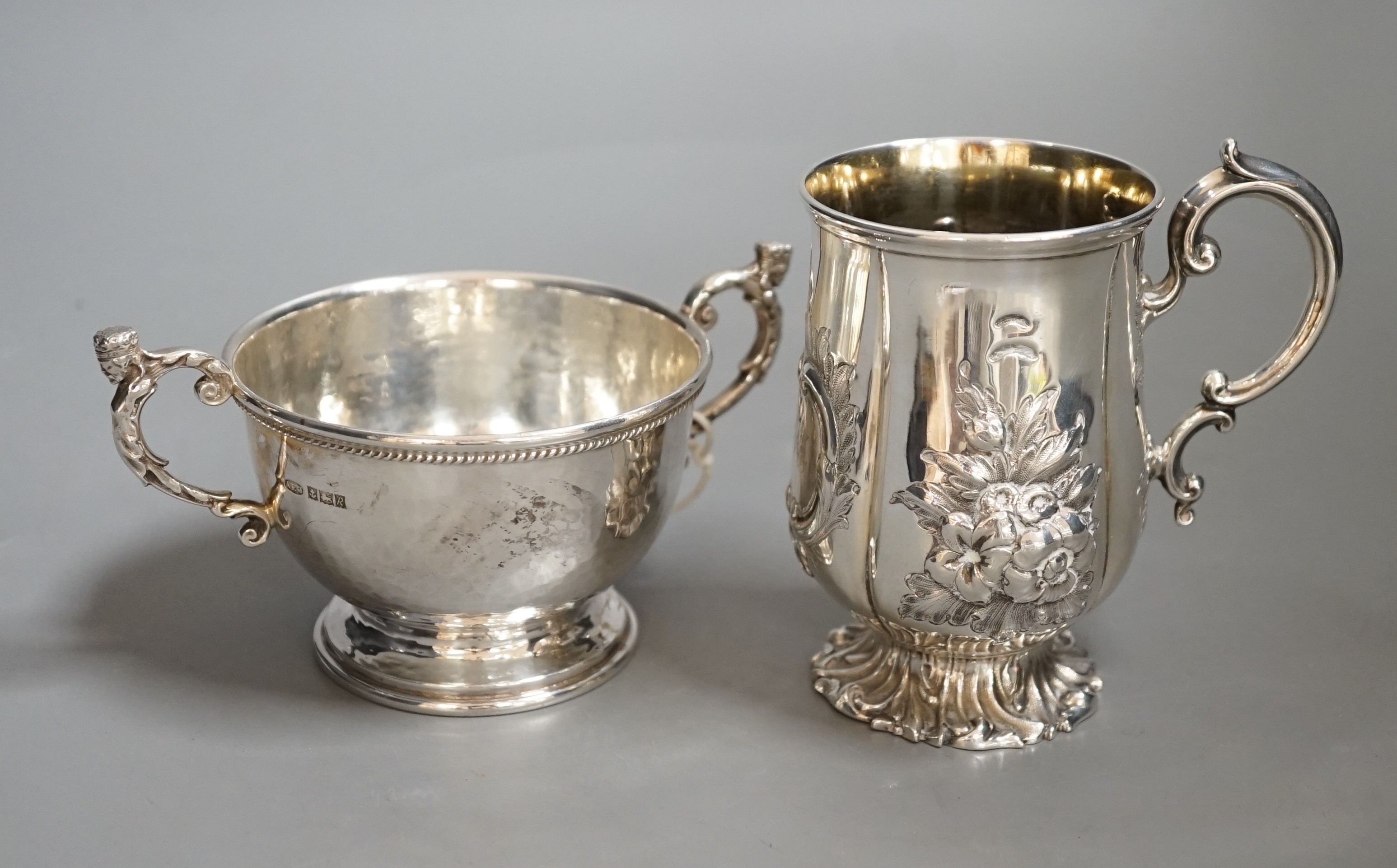 A Victorian embossed silver christening cup, Edward & John Barnard, London, 1848, 11cm and a modern small planished twin handled bowl by A.E. Jones Ltd.                                                                    