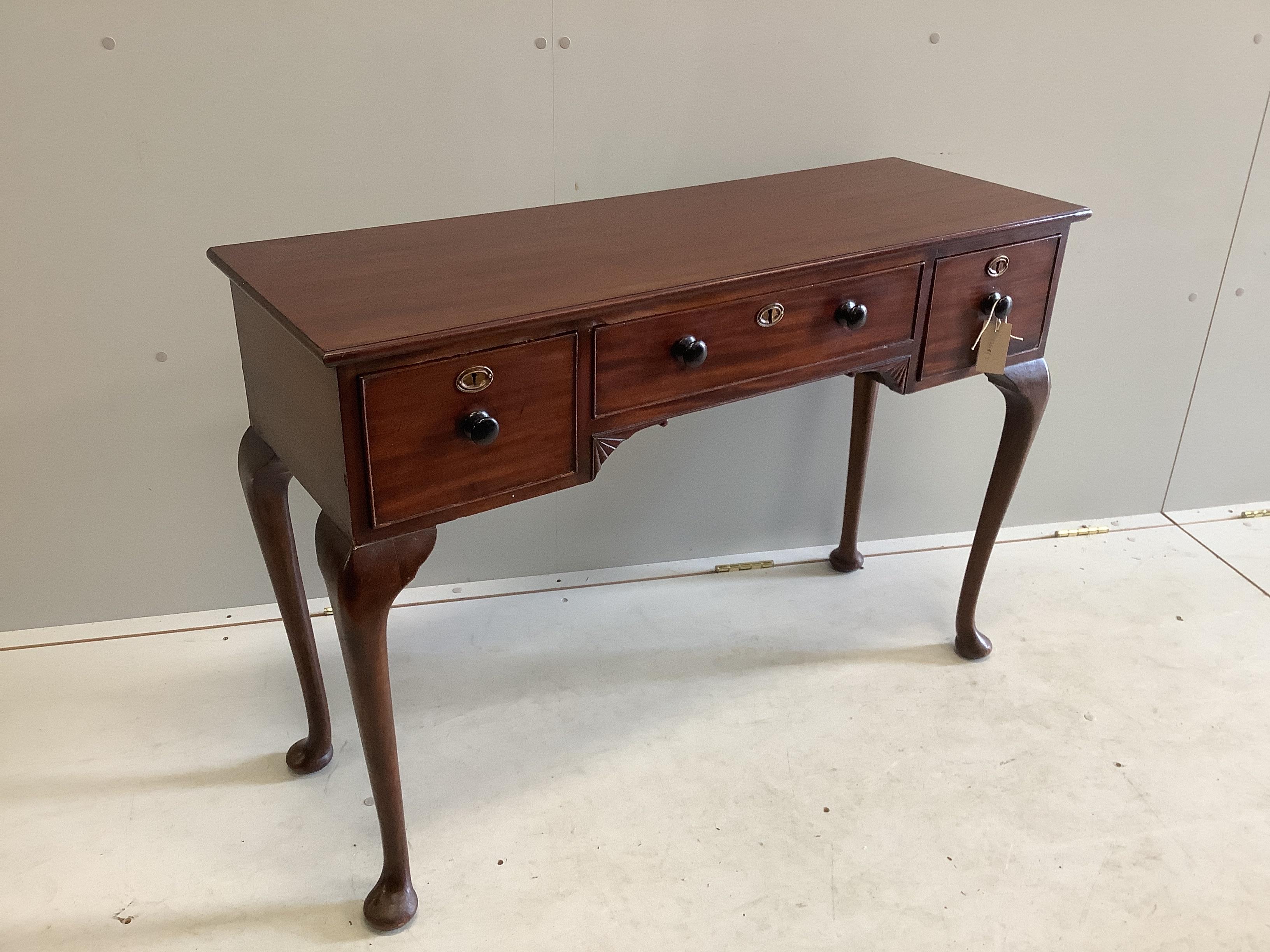 A mahogany three drawer console table, width 105cm, depth 36cm, height 73cm                                                                                                                                                 