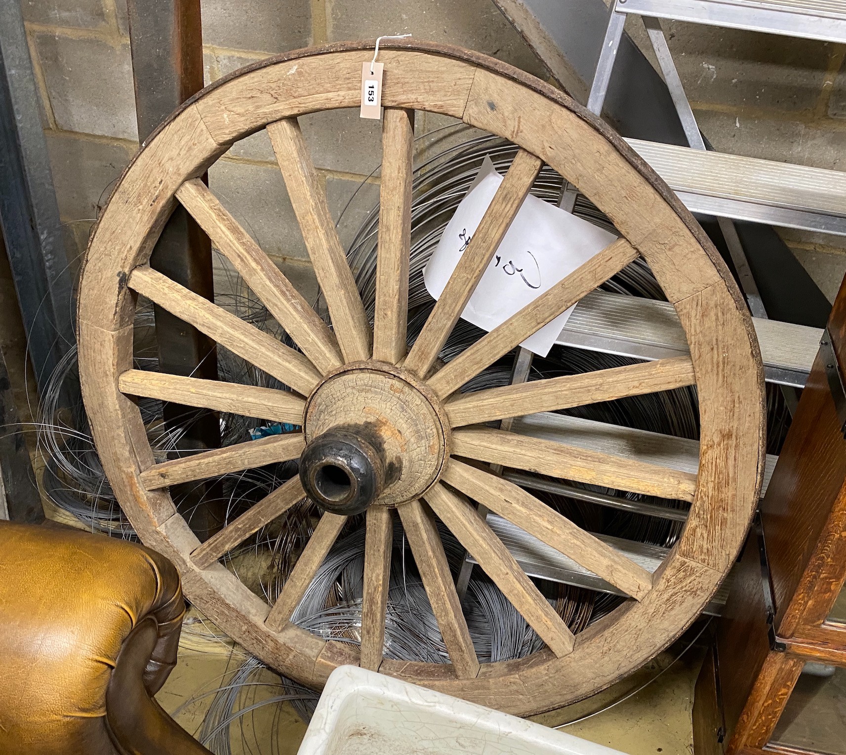 A vintage iron bound cart wheel, diameter 112cm                                                                                                                                                                             