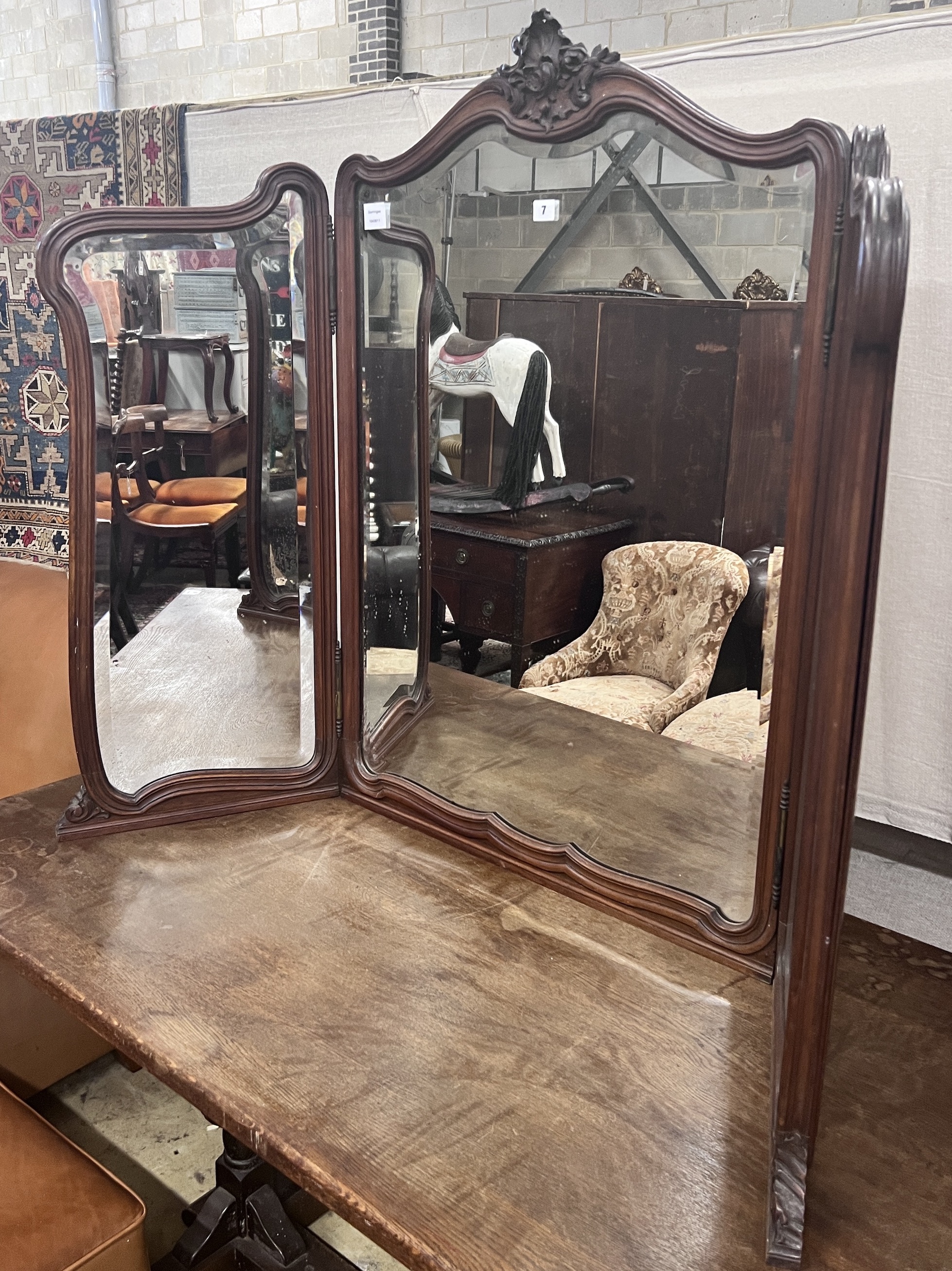 A late 19th century French mahogany triple folding dressing table mirror, width 146cm, height 105cm                                                                                                                         