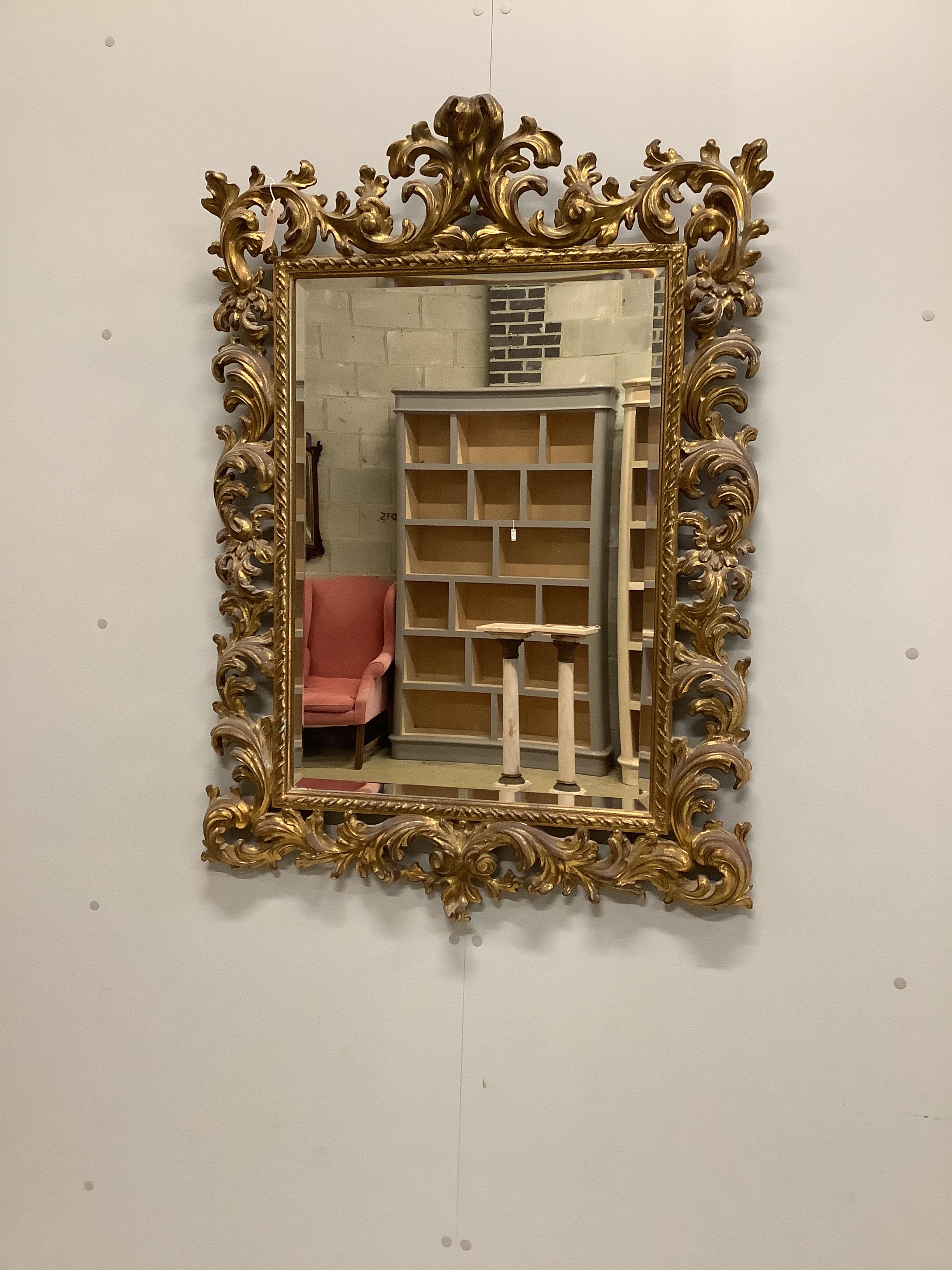 An 18th century style gilt composition wall mirror, width 80cm, height 110cm                                                                                                                                                